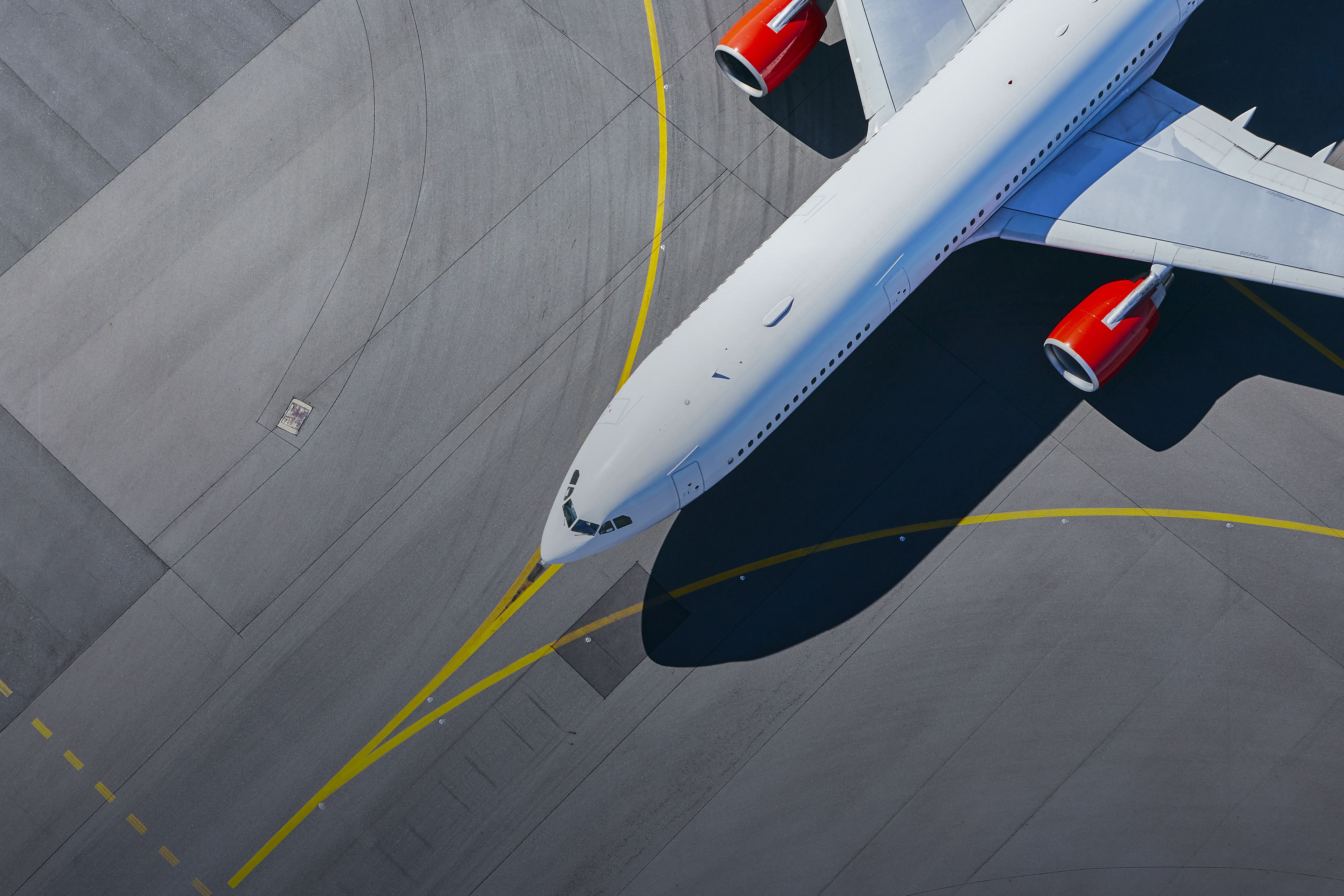 Aerial view of plane on the runway at airport