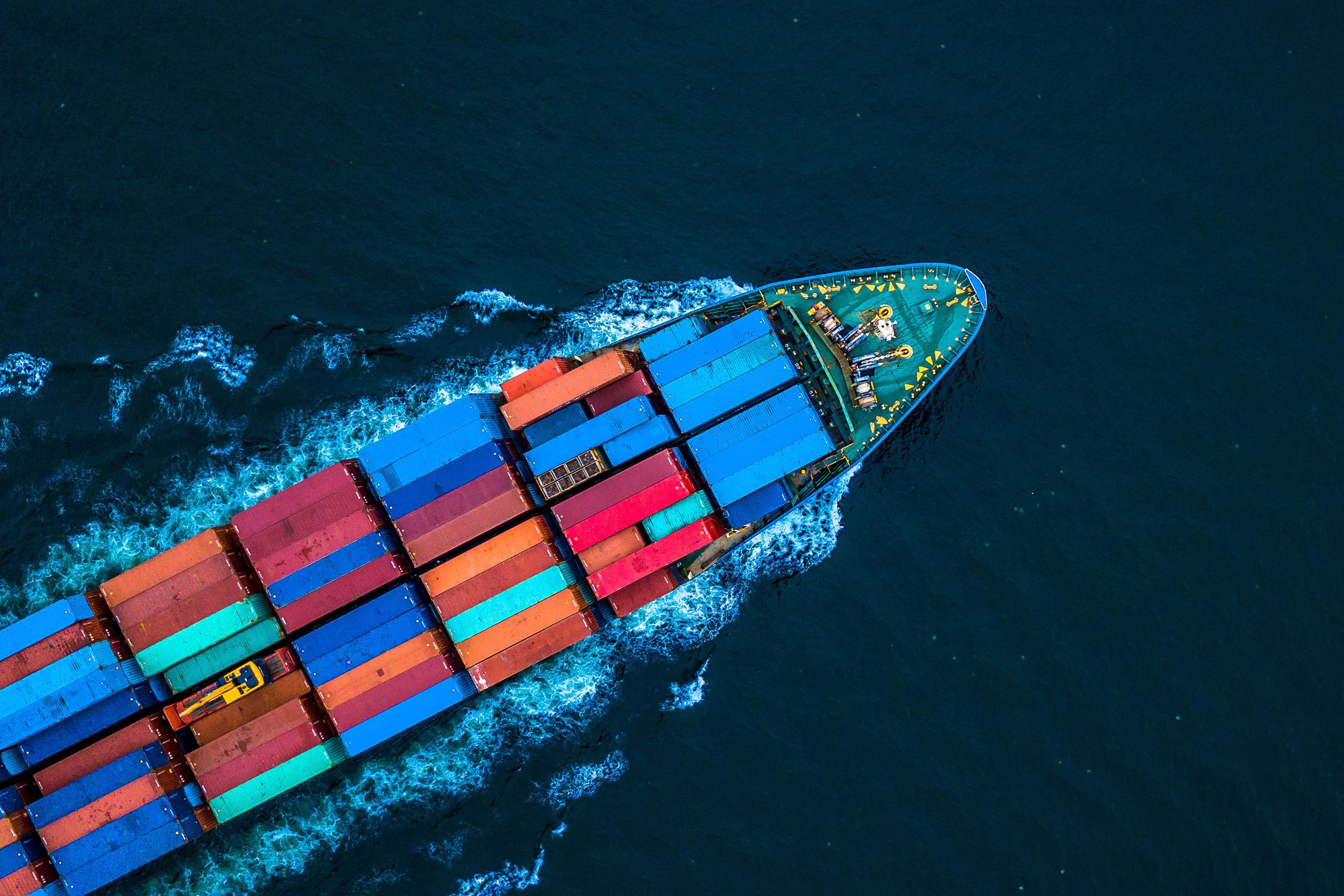 Aerial top view of a container ship in the sea