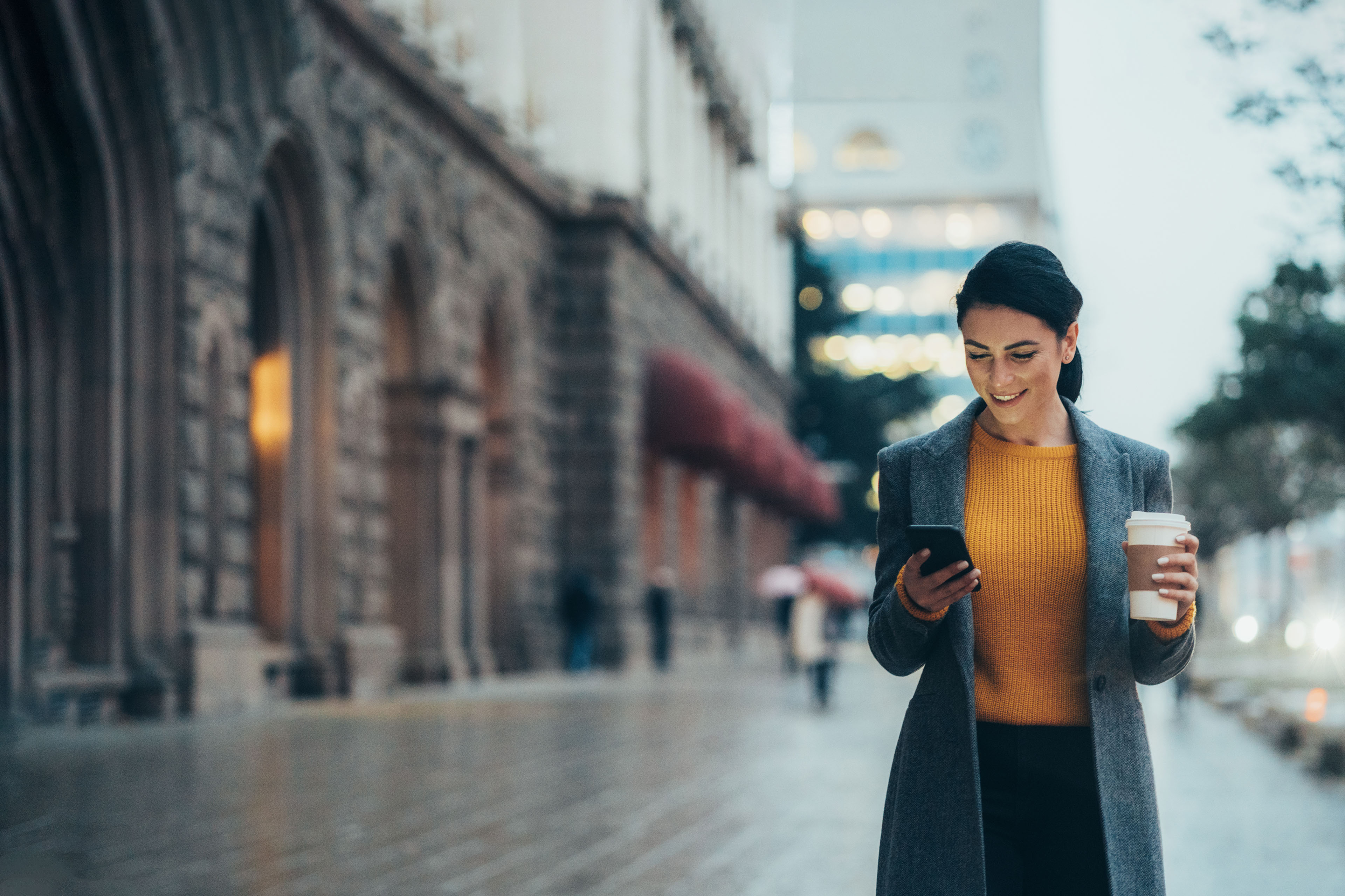 Modern young women walking on the city