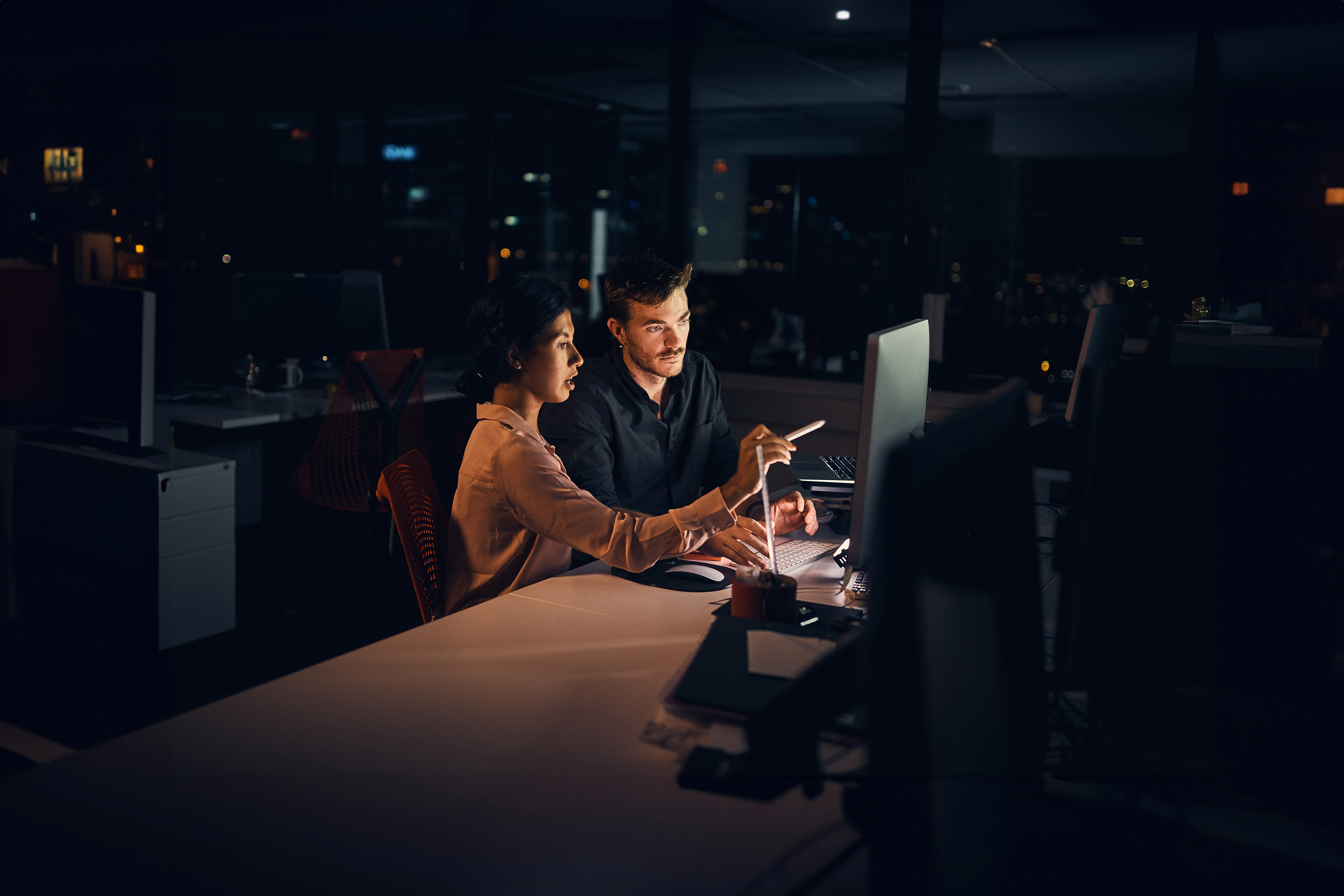 Two businesspeople working in an office