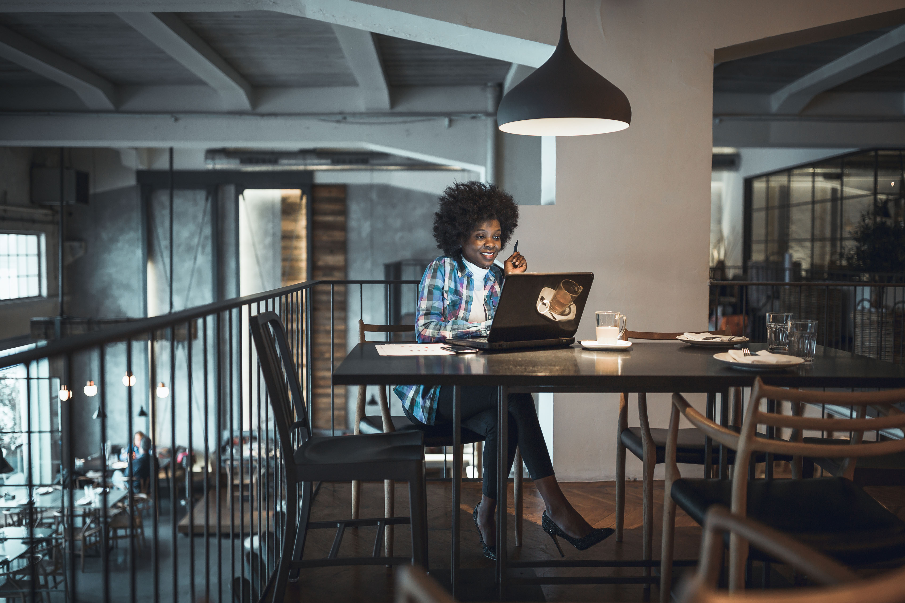 Woman drinking coffee and shopping online