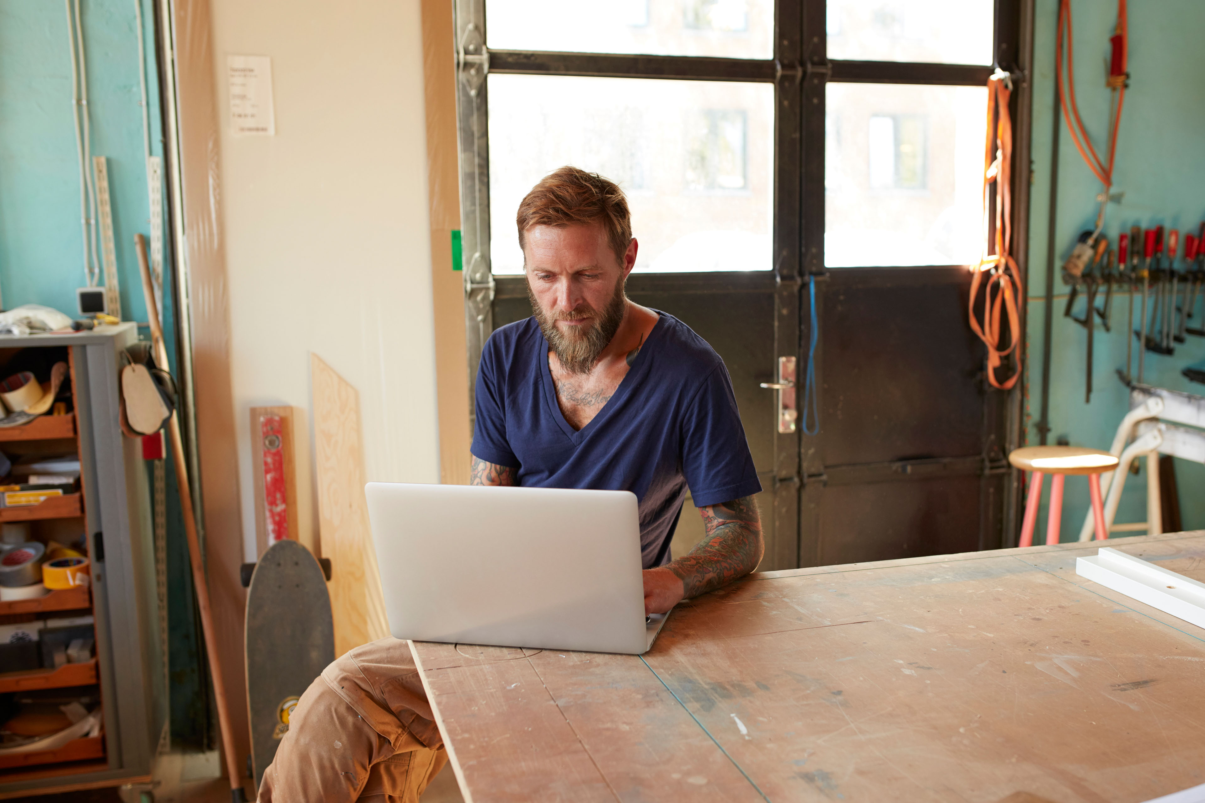 Wood designer working with laptop