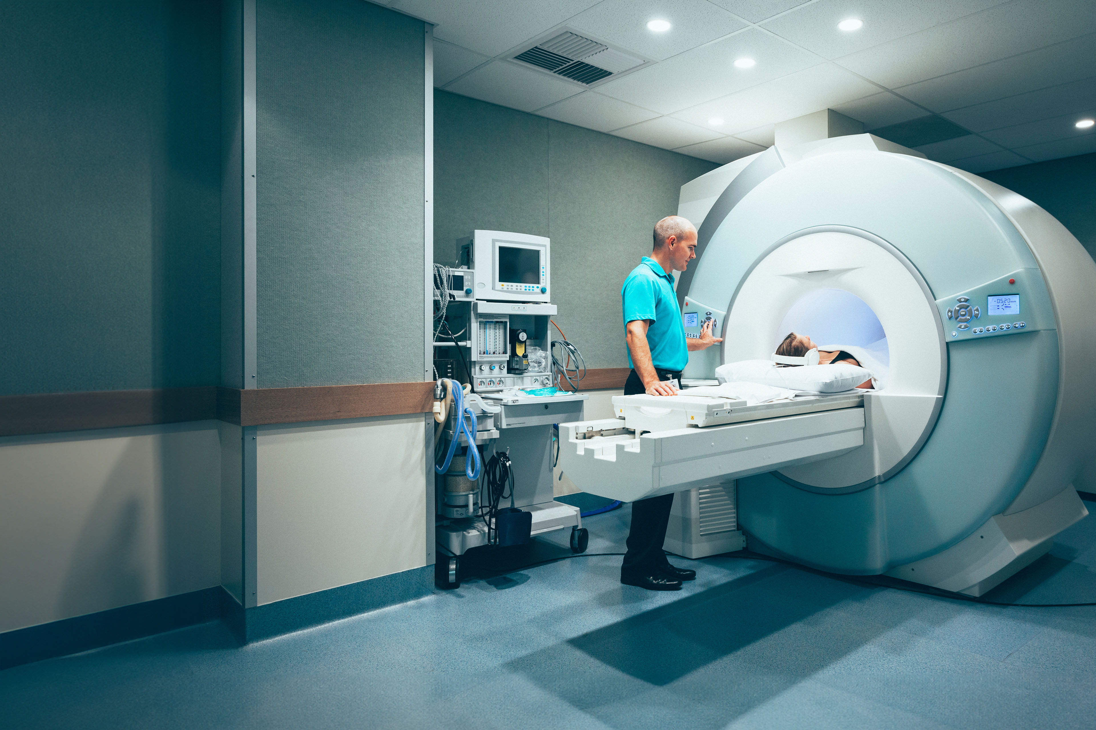 CT scanner in private hospital with patient and doctor