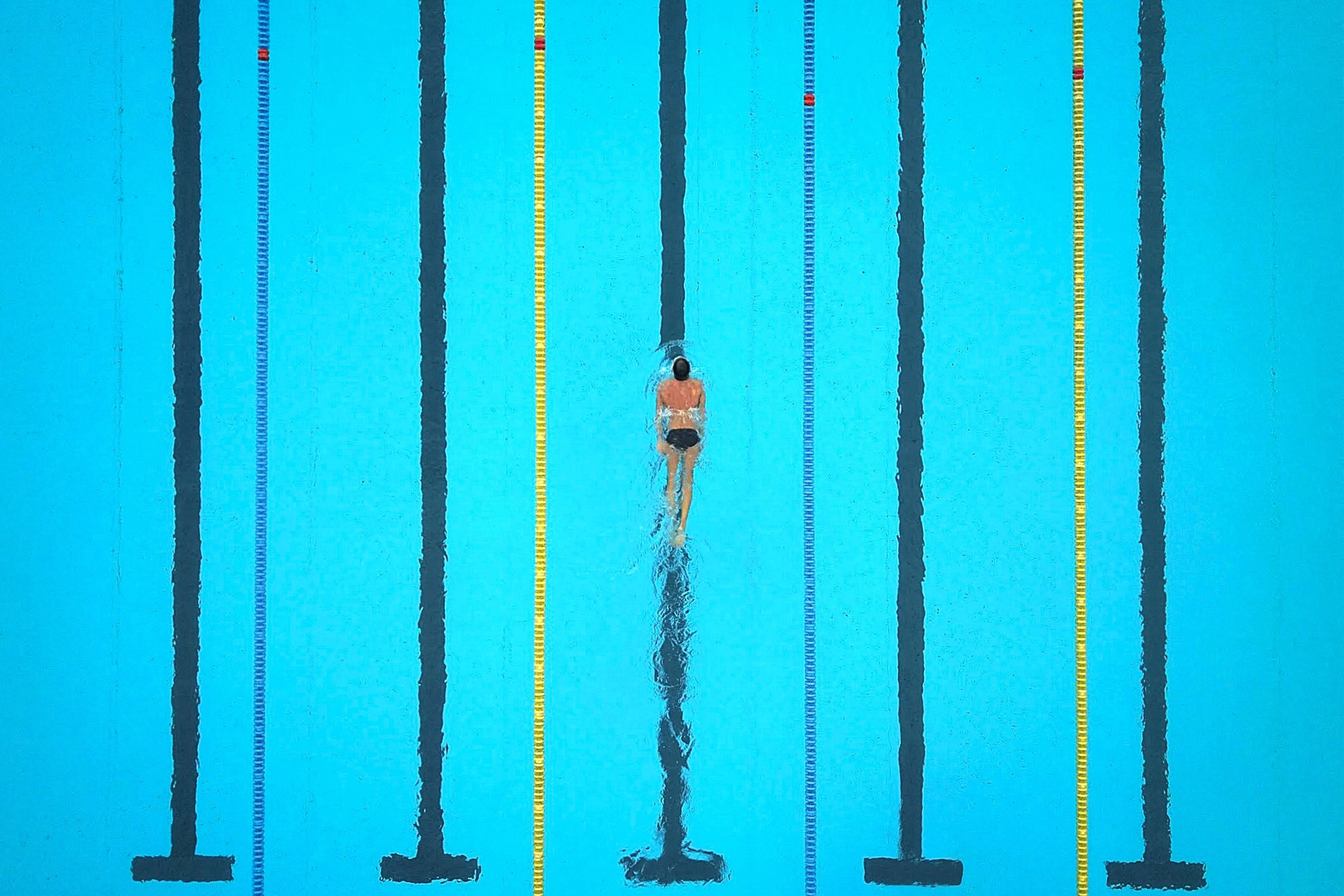 High angle view of an athlete swimming in pool