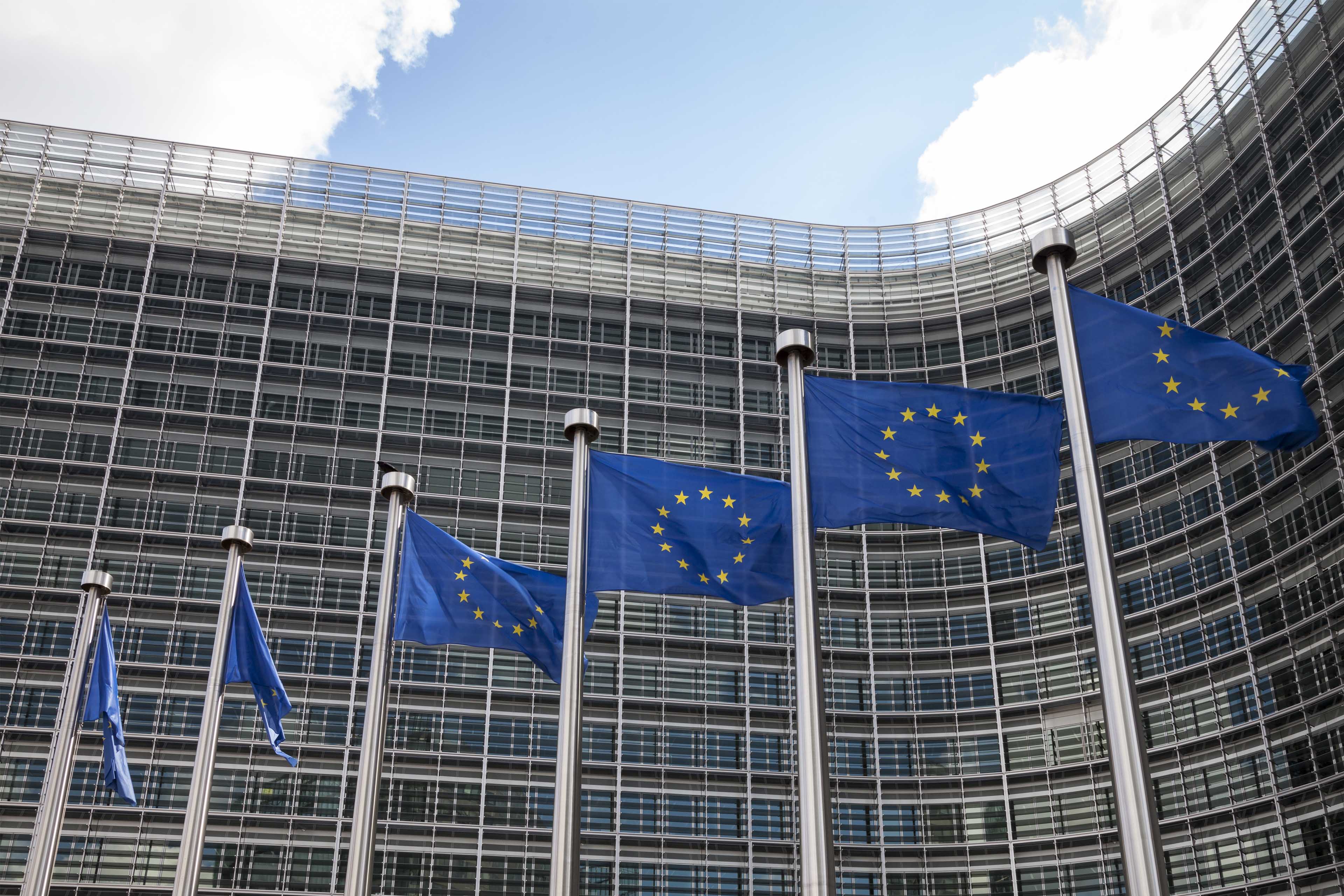 European Union flags waving up in the flag post