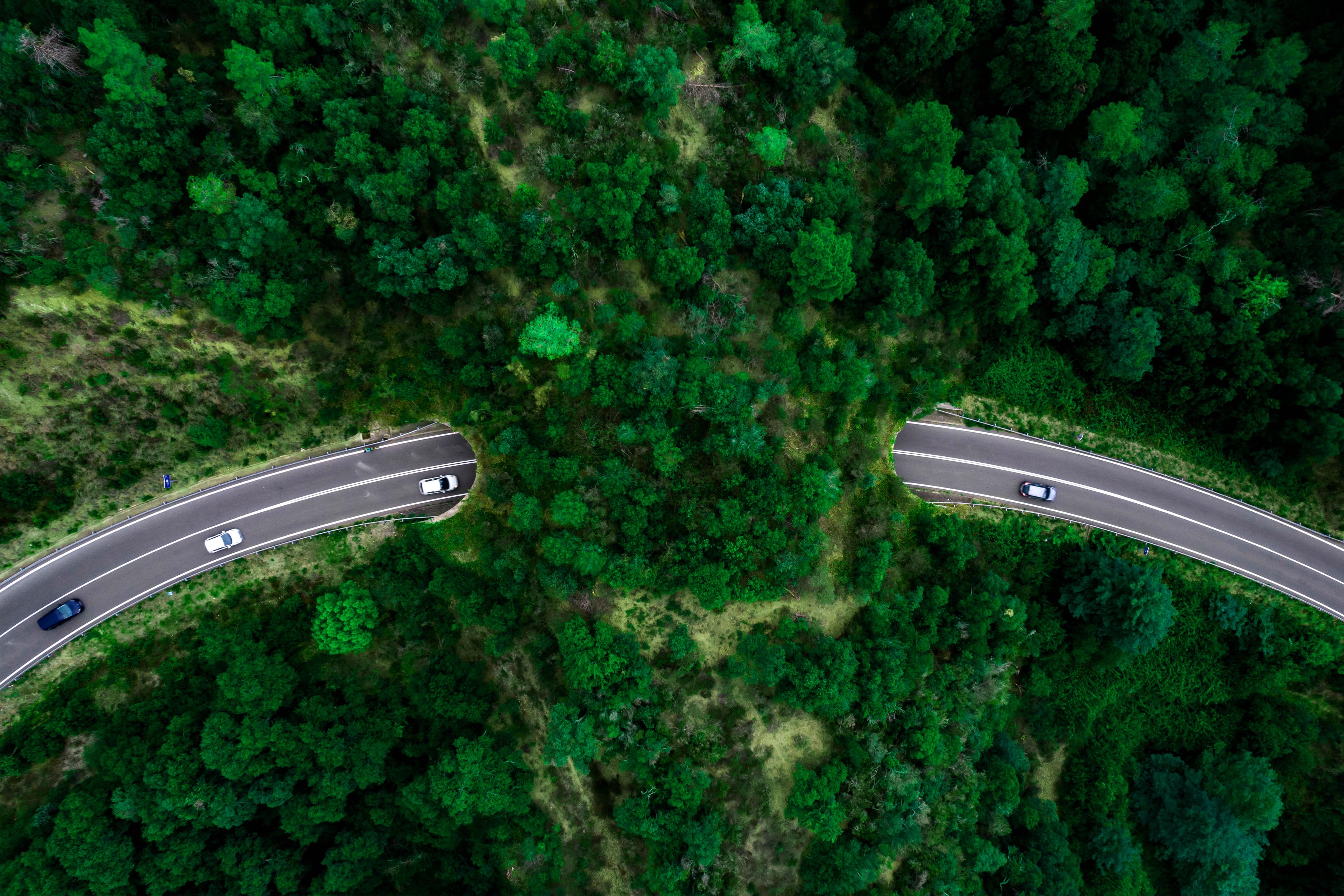 View from above of the vehicles going through tunnel