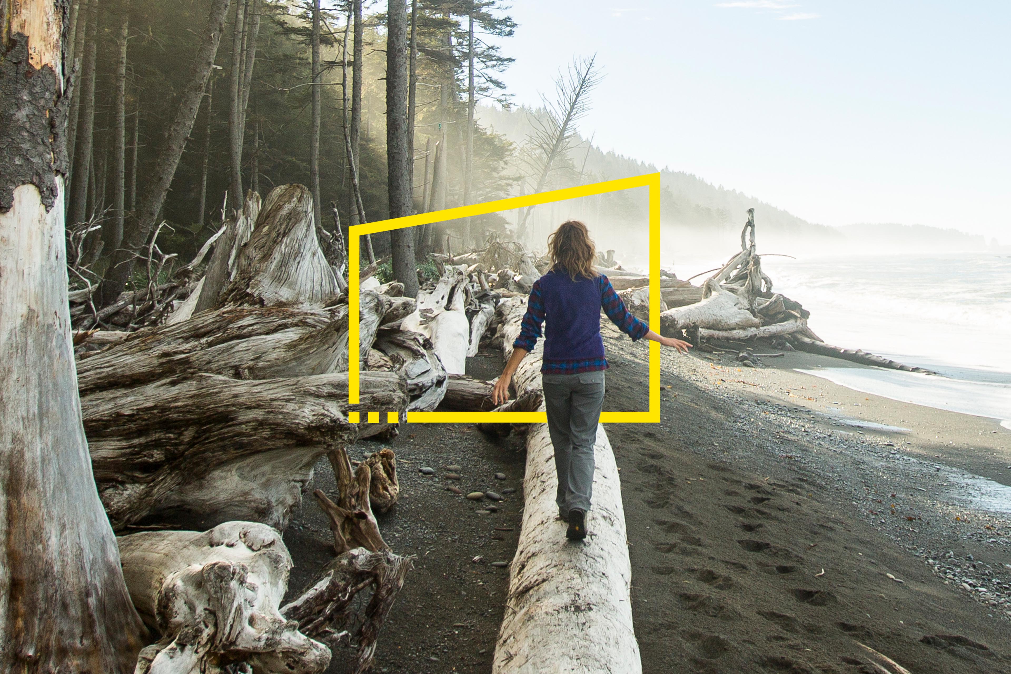 Woman walking on a tree trunk in beach