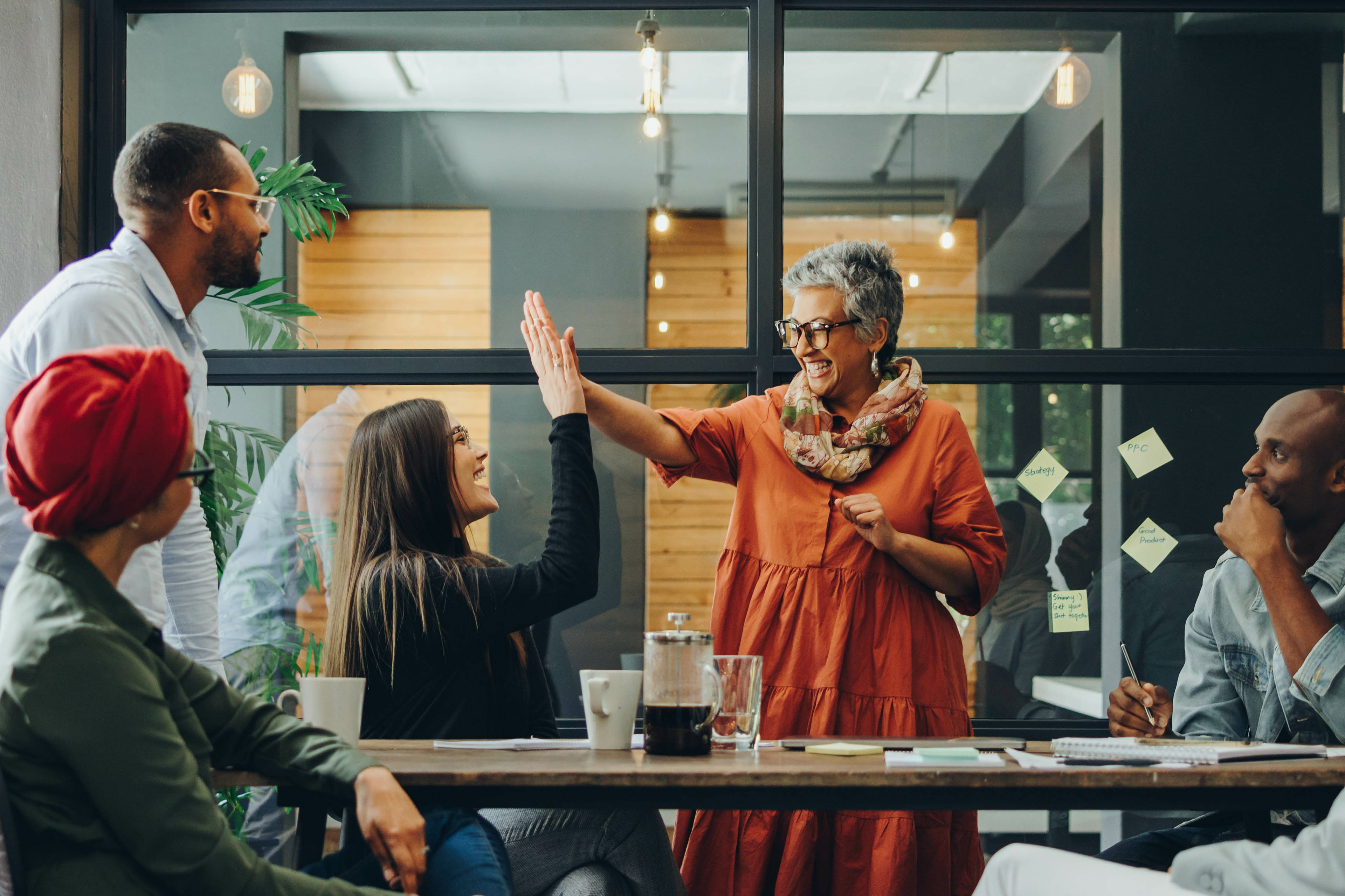 Successful businesswomen celebrating their achievement in office