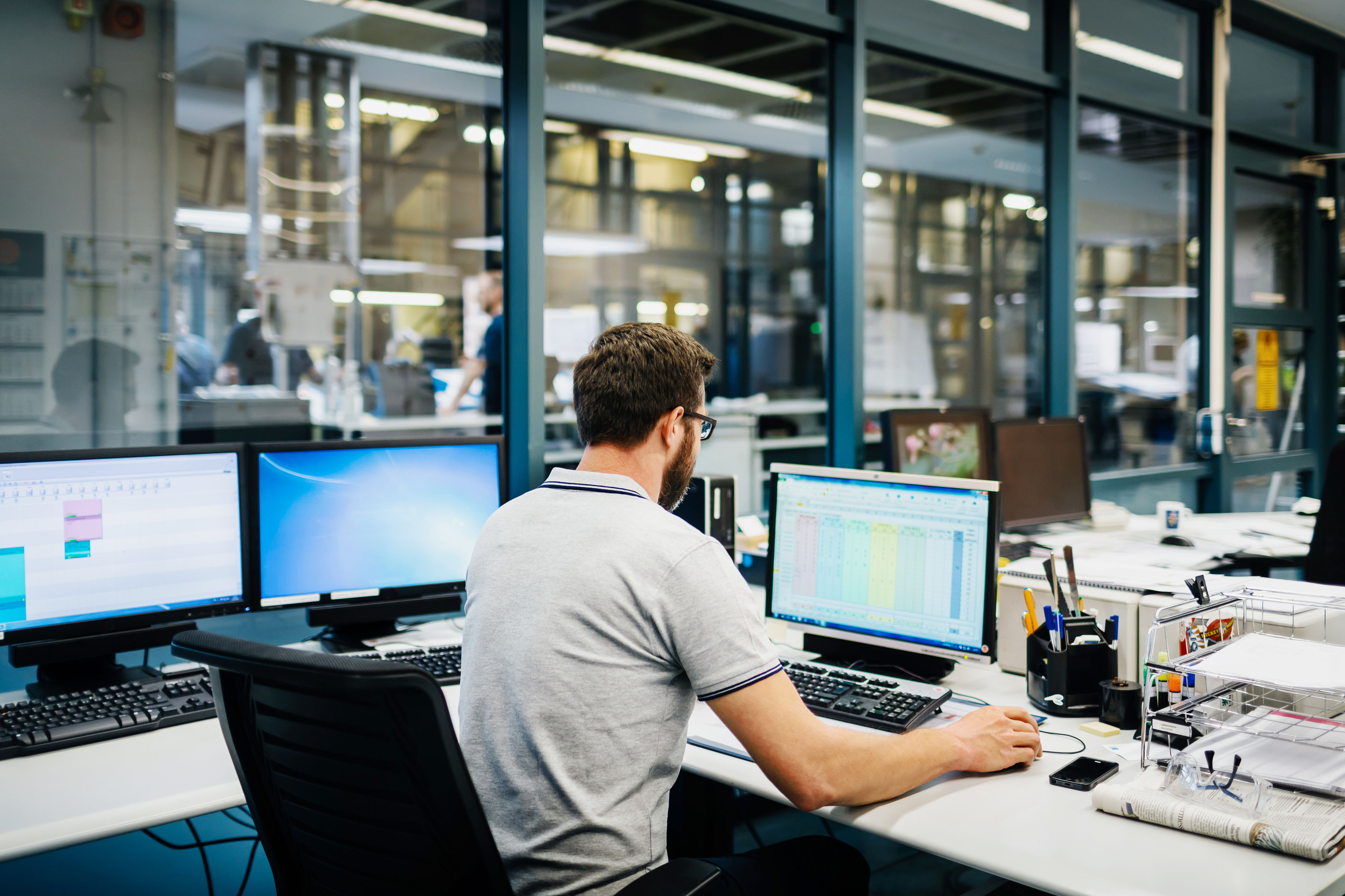 Engineer in control room of a factory