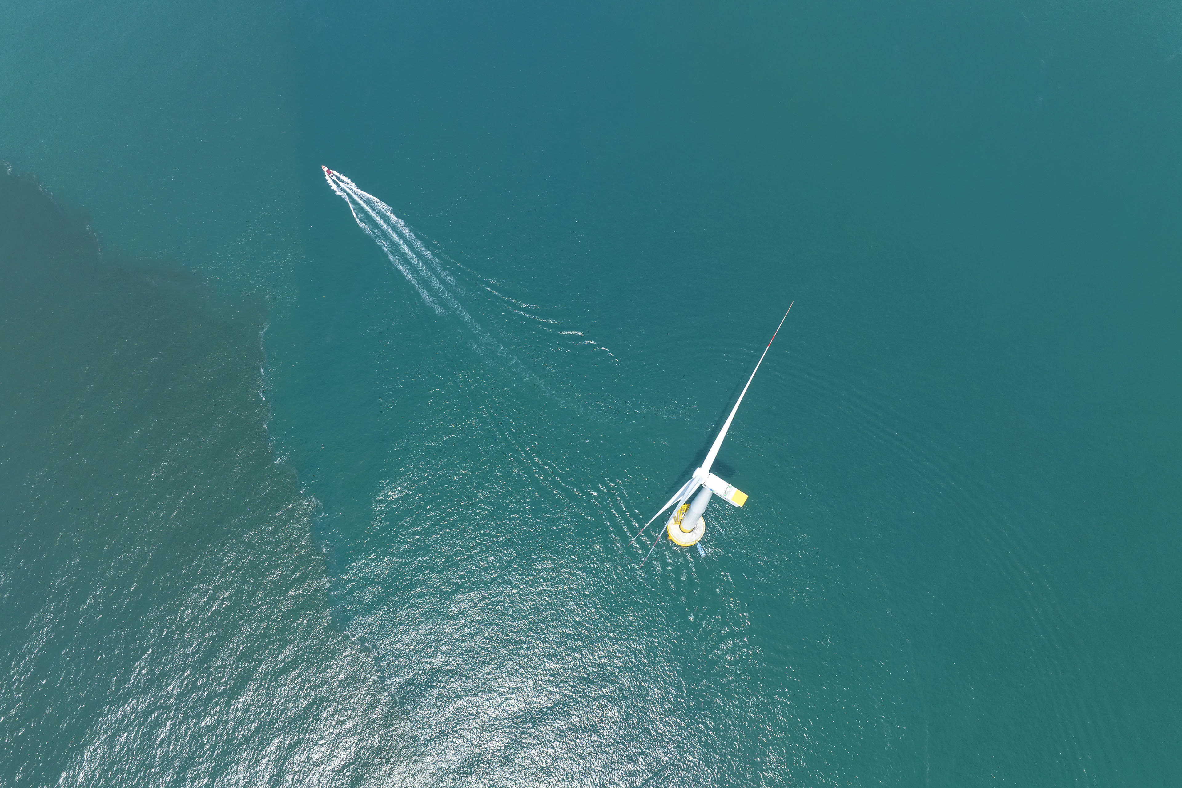 Aerial view of the majestic offshore wind turbine farm