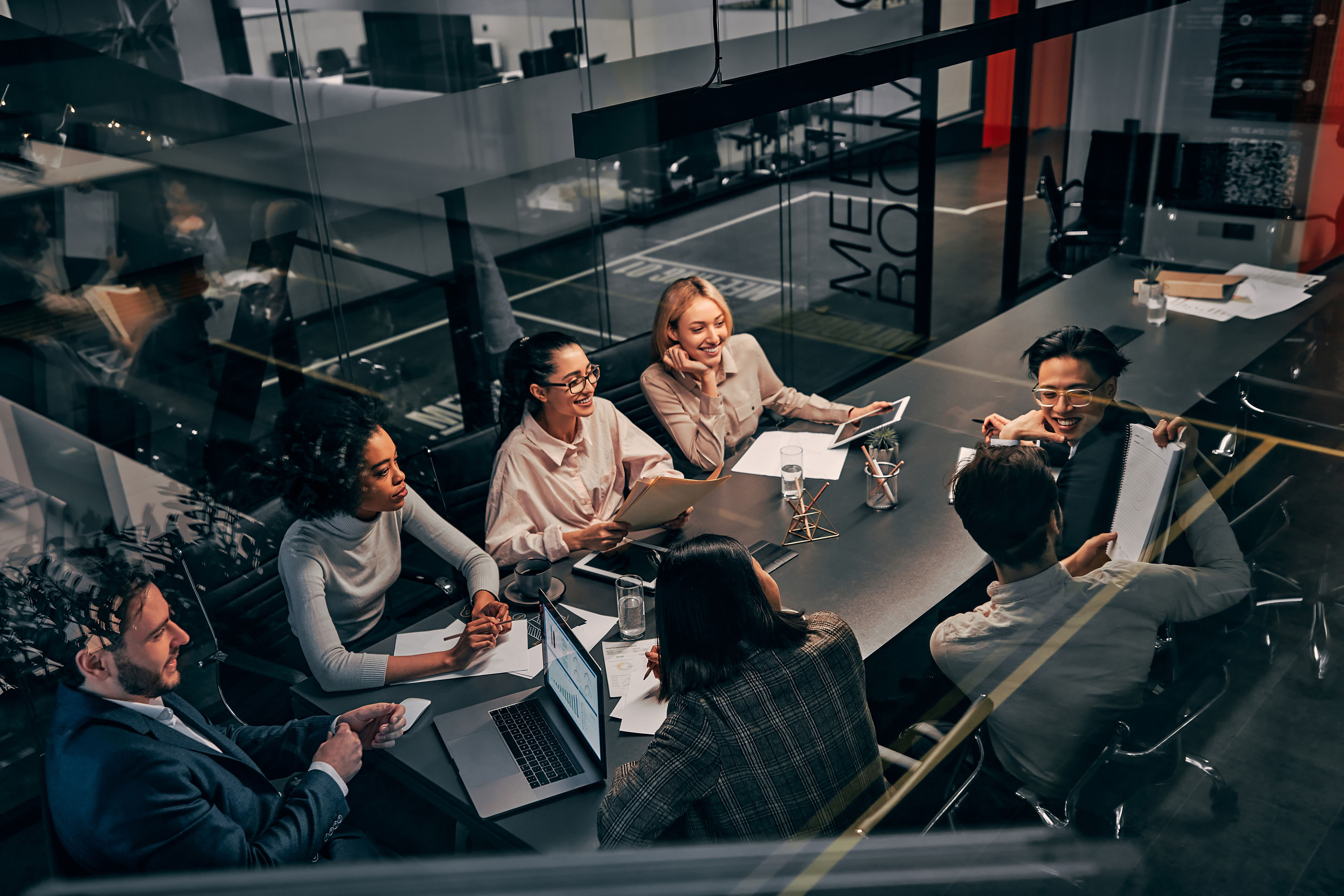 Business team working in an office communicating and discussing work