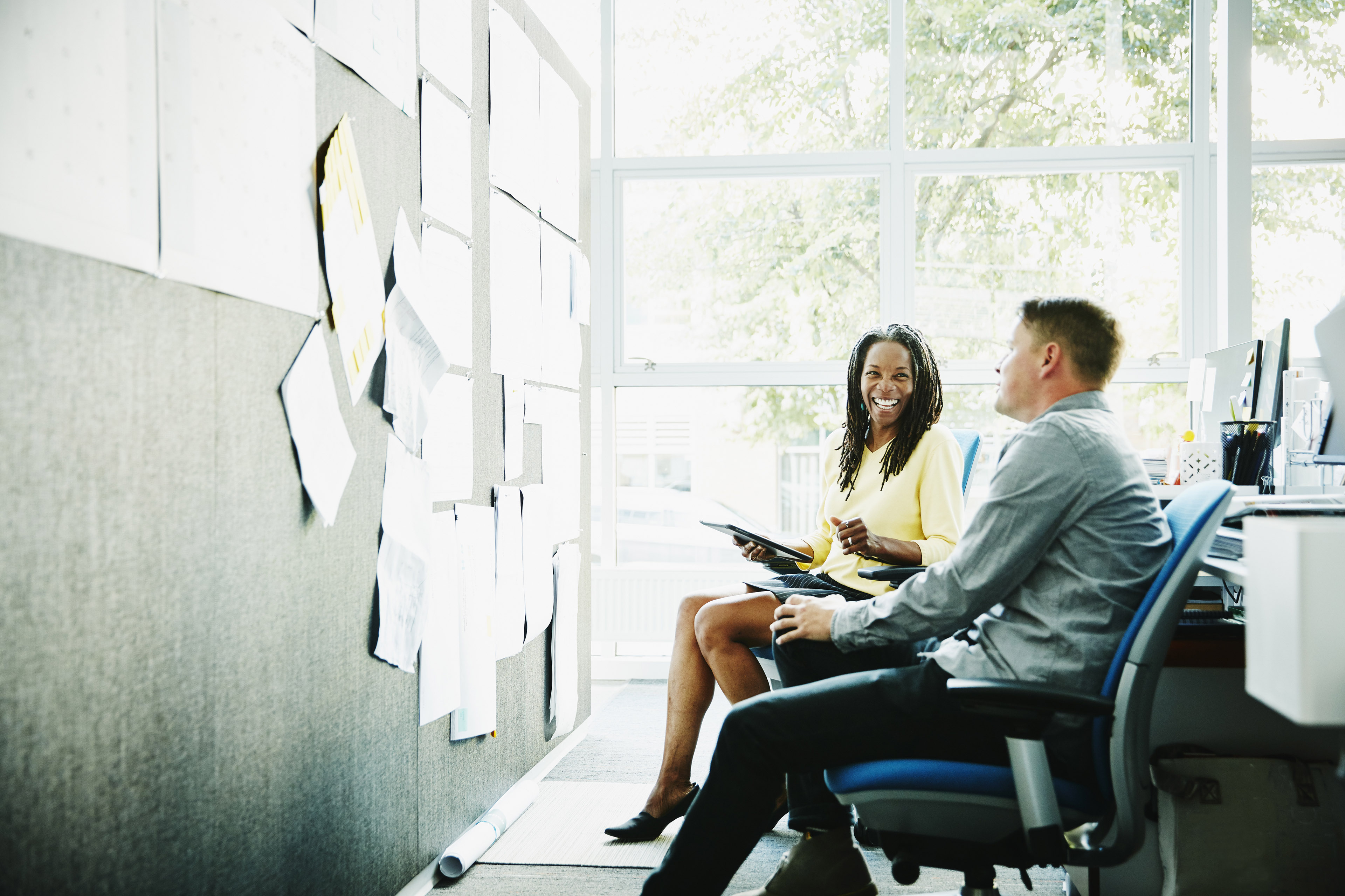 Businesswoman discussing project with colleague