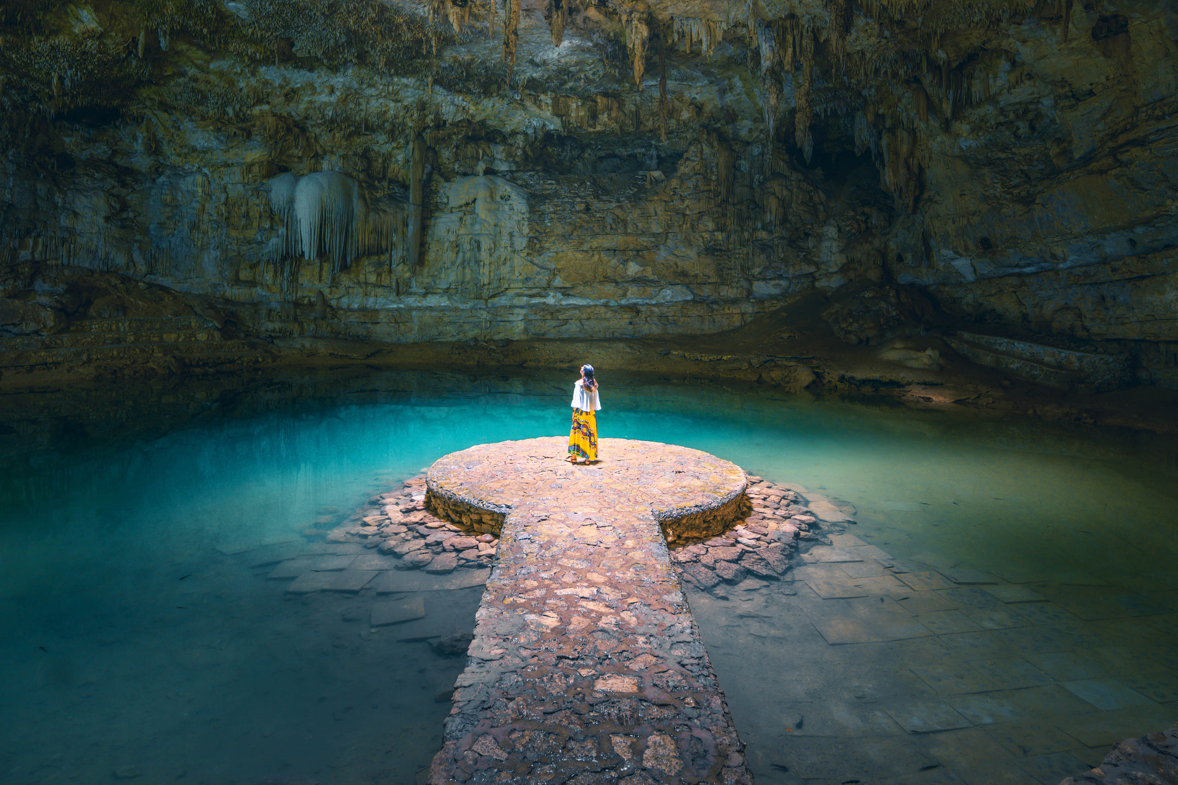 Woman alone in a cenote, Mexico