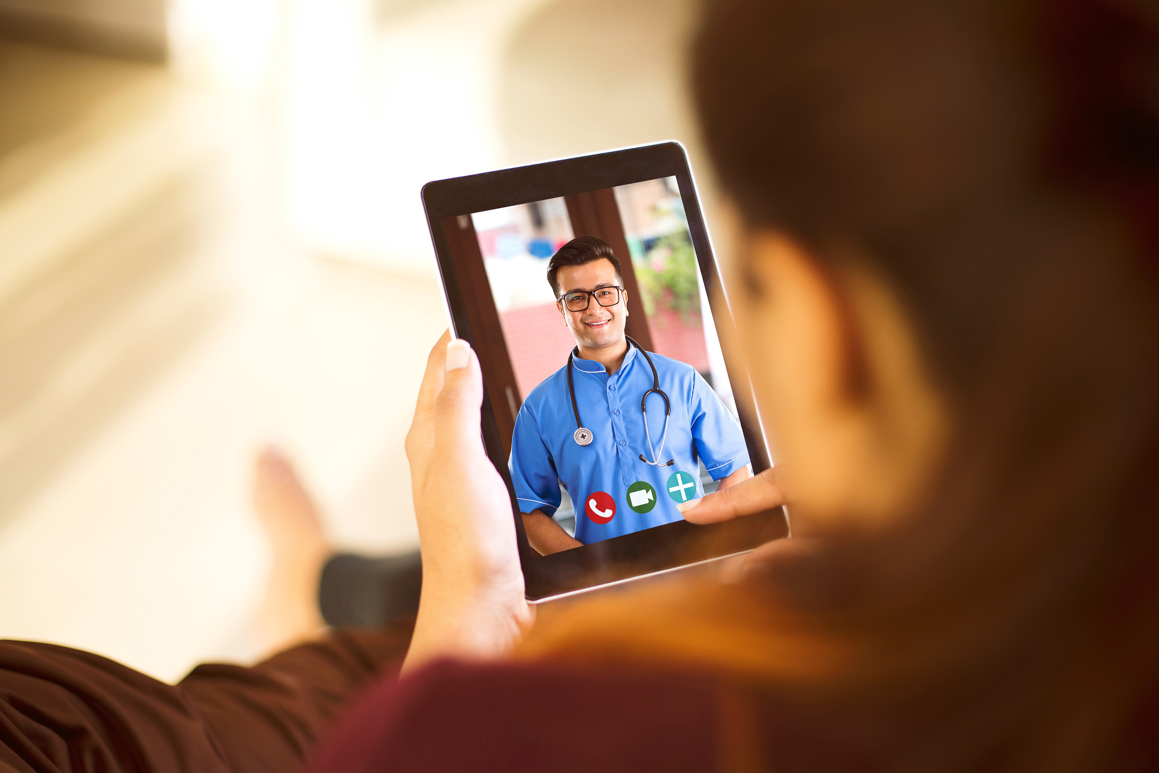 Woman in video conference with doctor