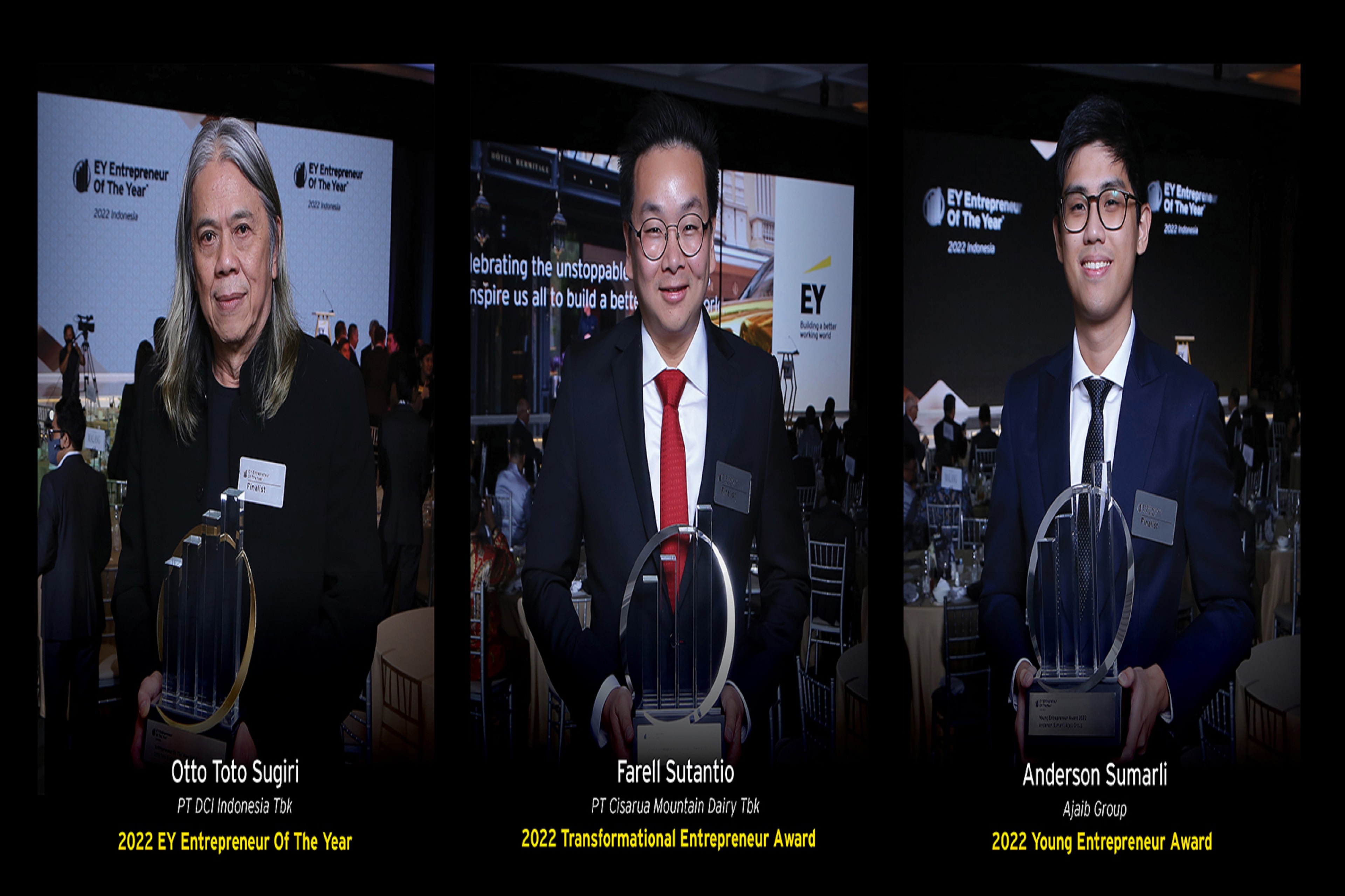 Three business people holding there awards