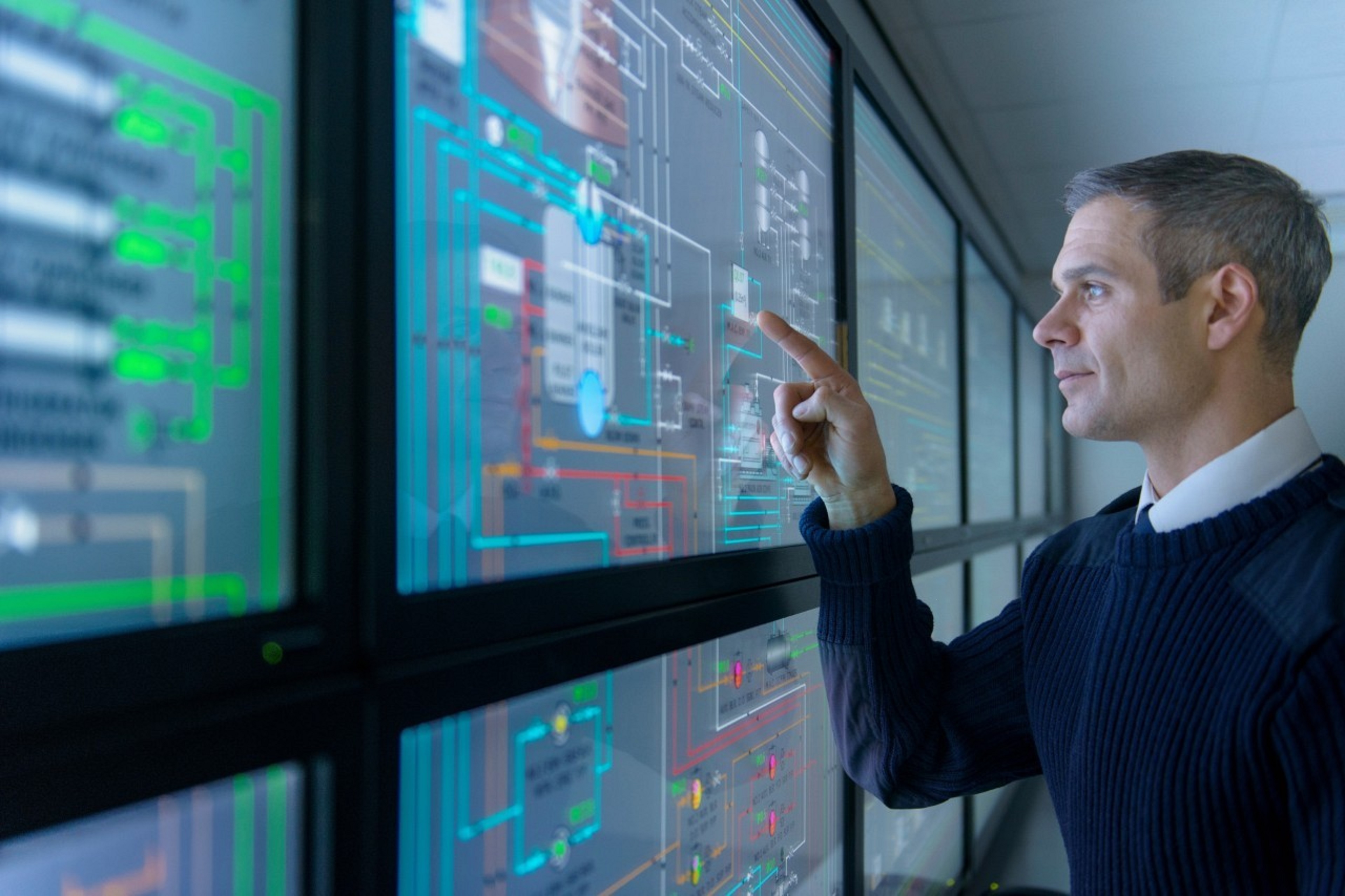 Man checking the stocks on the screen