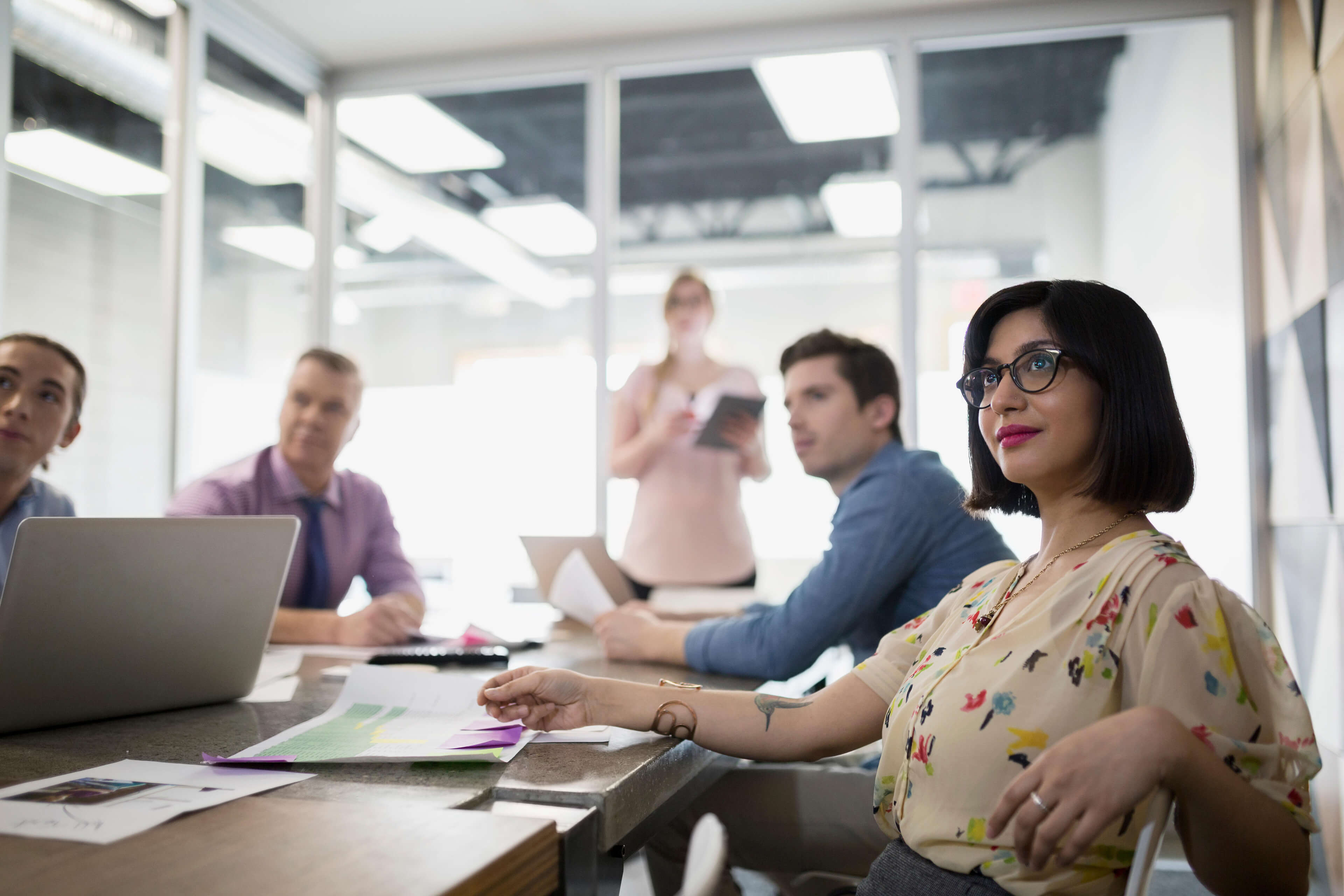 Businesswoman gesturing in conference room meeting