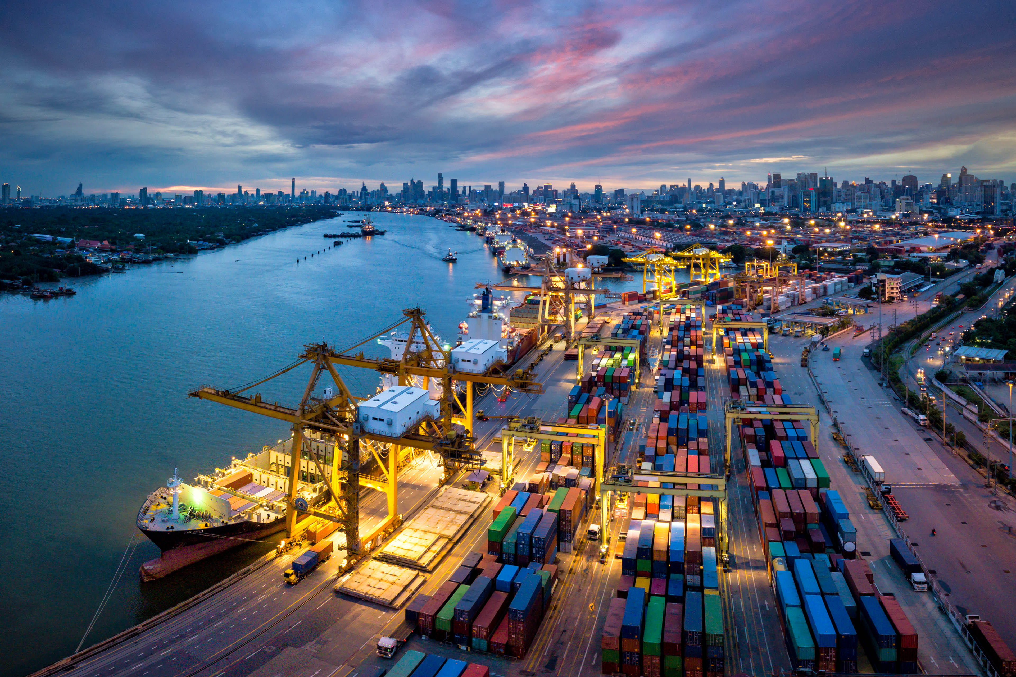 Aerial view of international port with crane loading containers