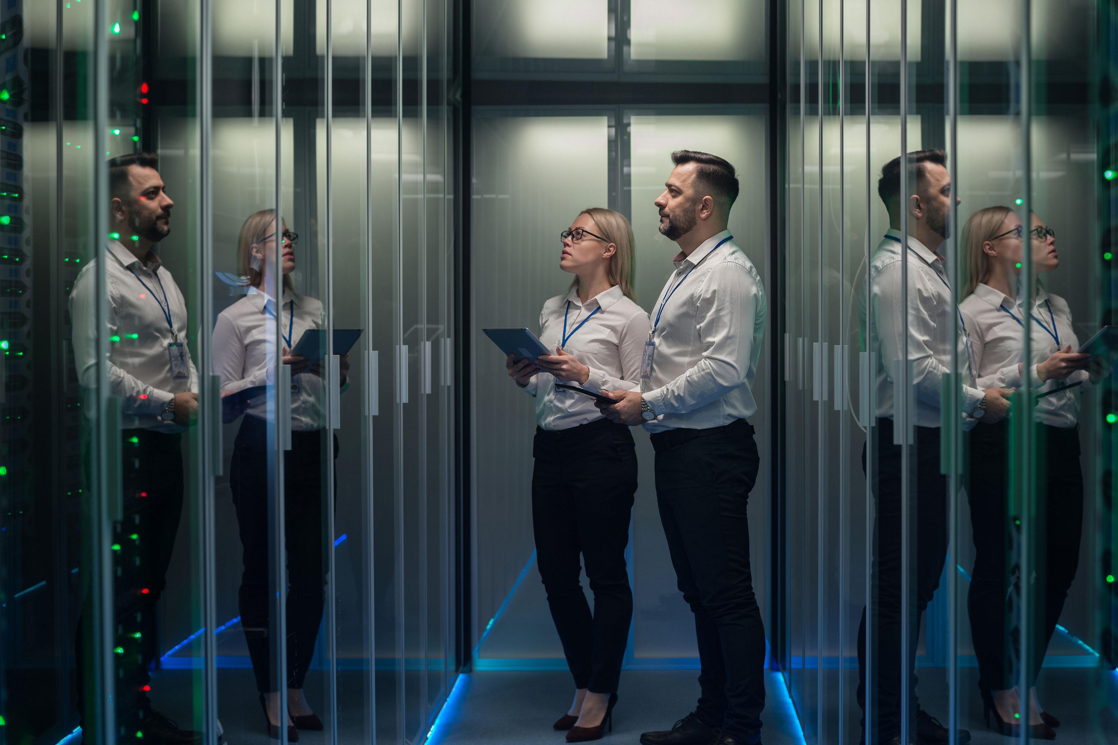 Workers walking through data center