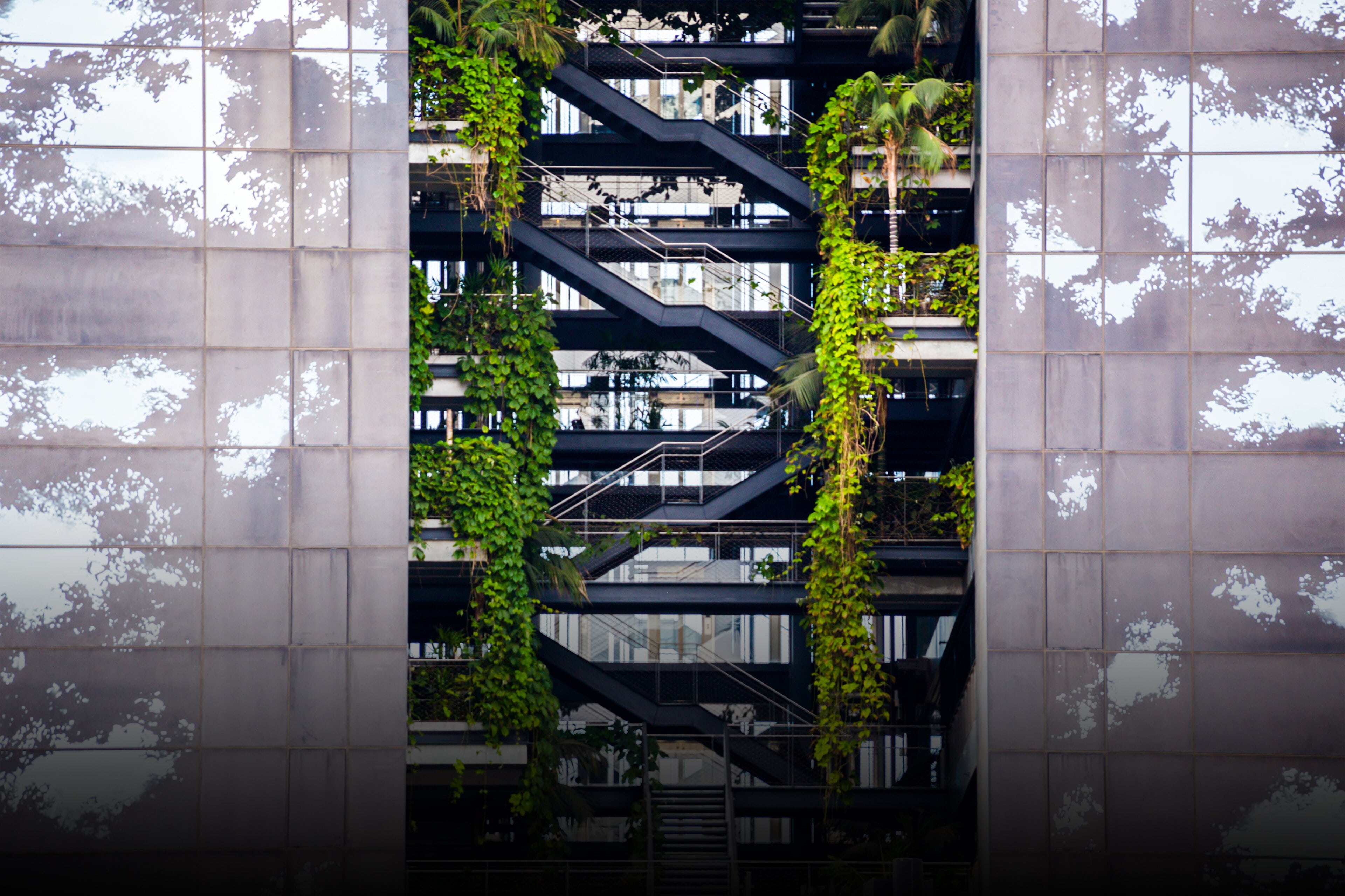 EY building with levels and vegetation growing inside