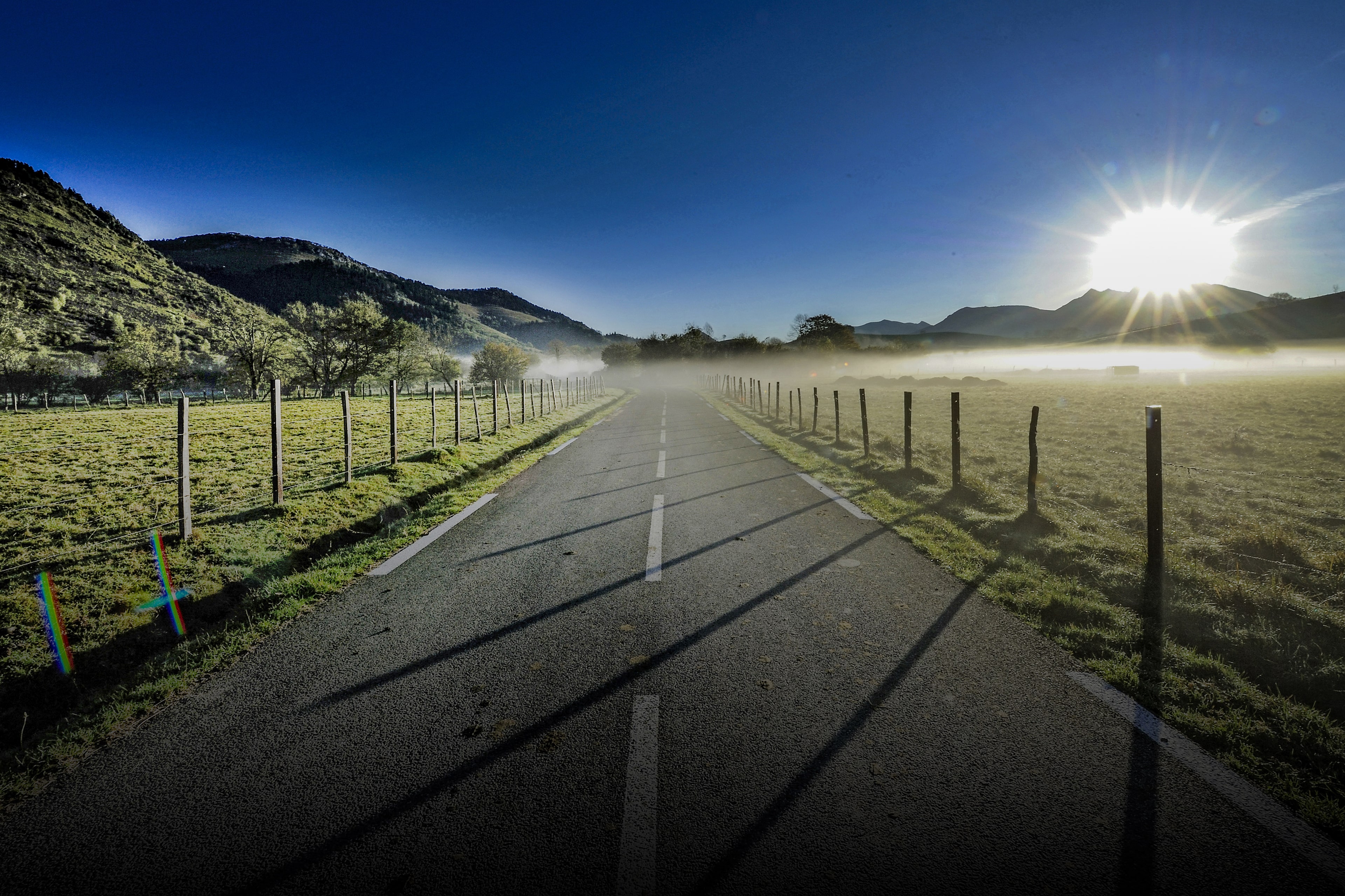 Road in between mountains and fields_v2