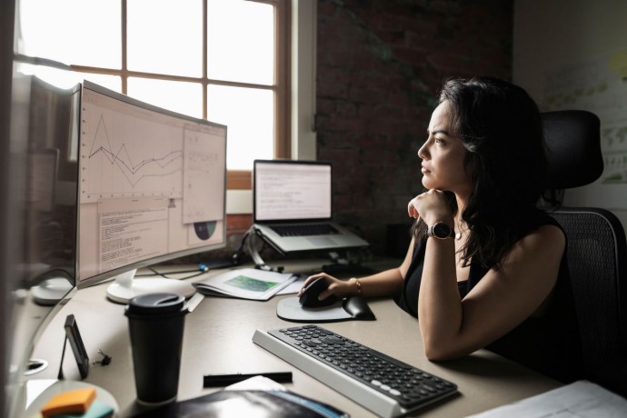 Young woman checking data in the monitor