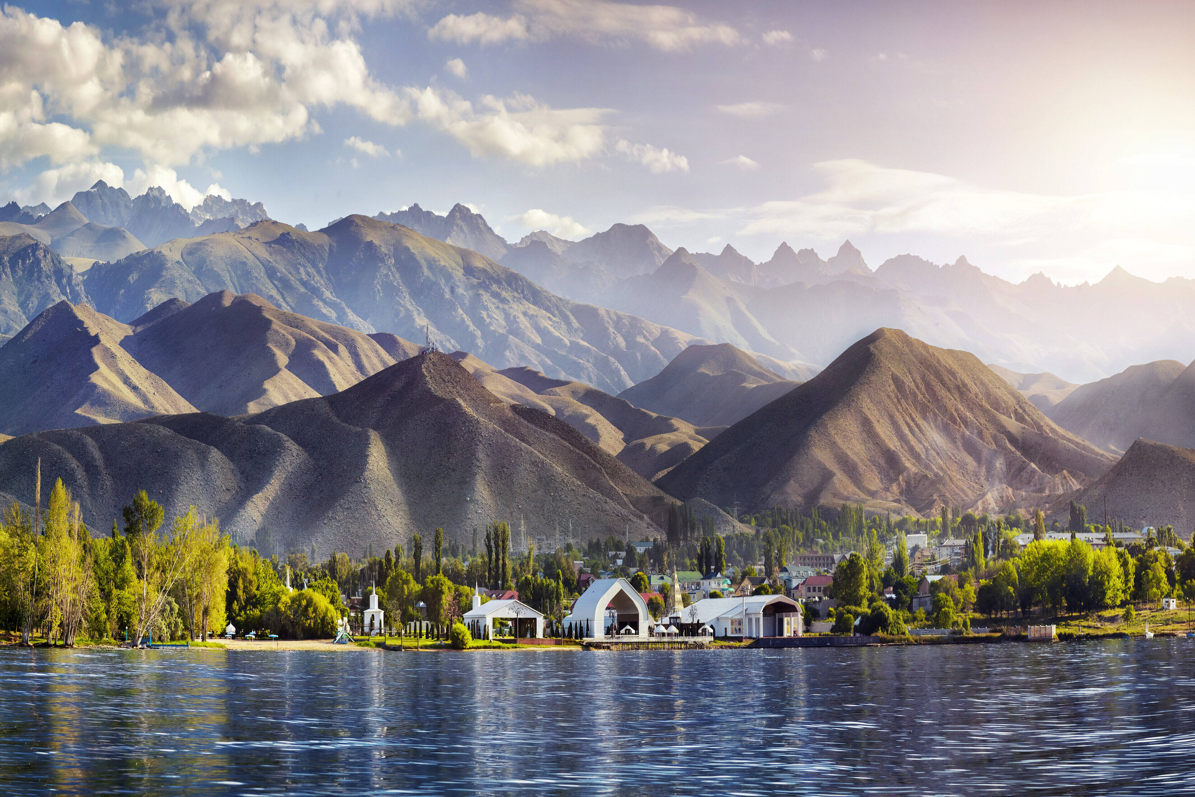 View to Ruh Ordo cultural complex near Issyk Kul lake at mountains background in Cholpon Ata, Kyrgyzstan