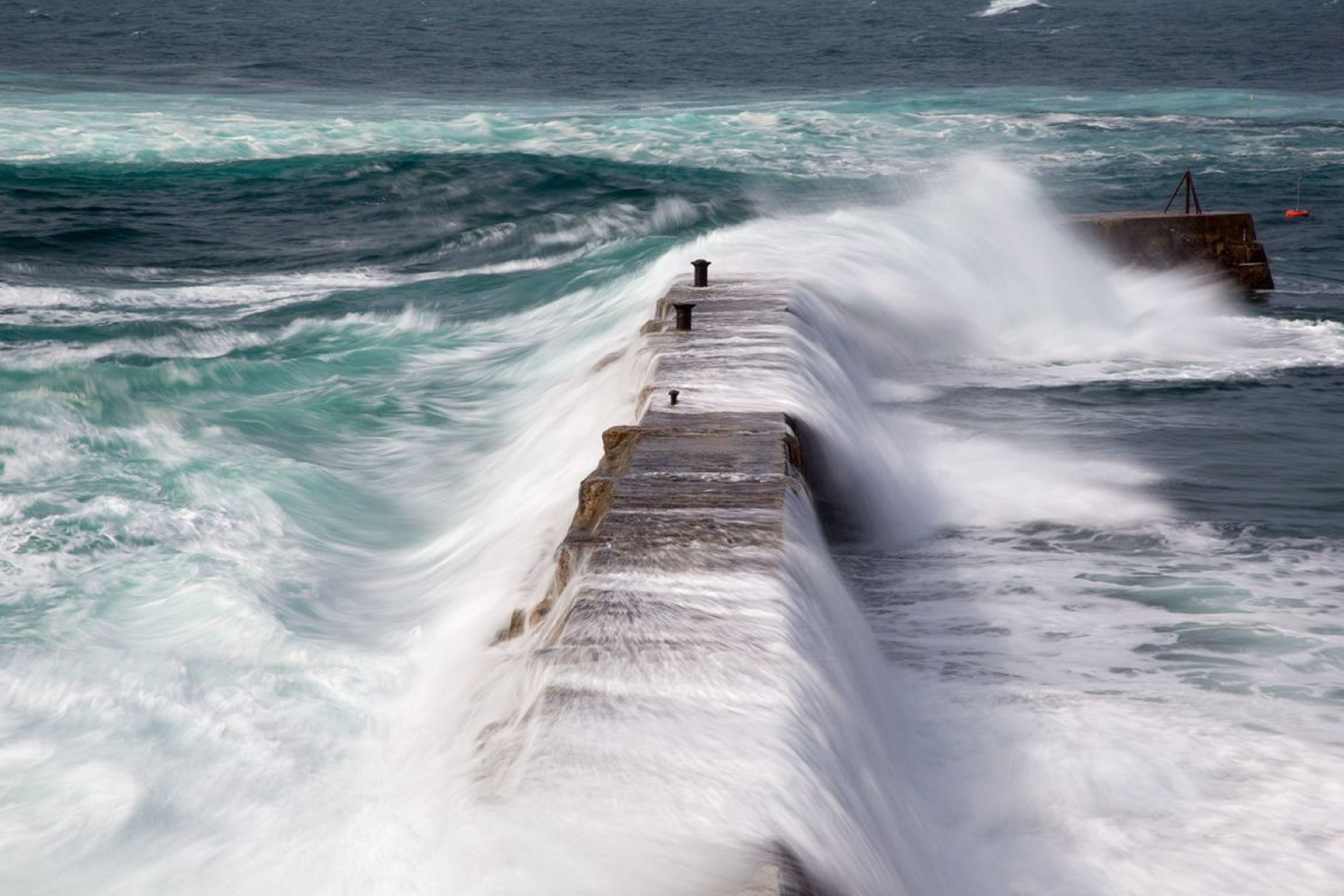 waves glide over bridge