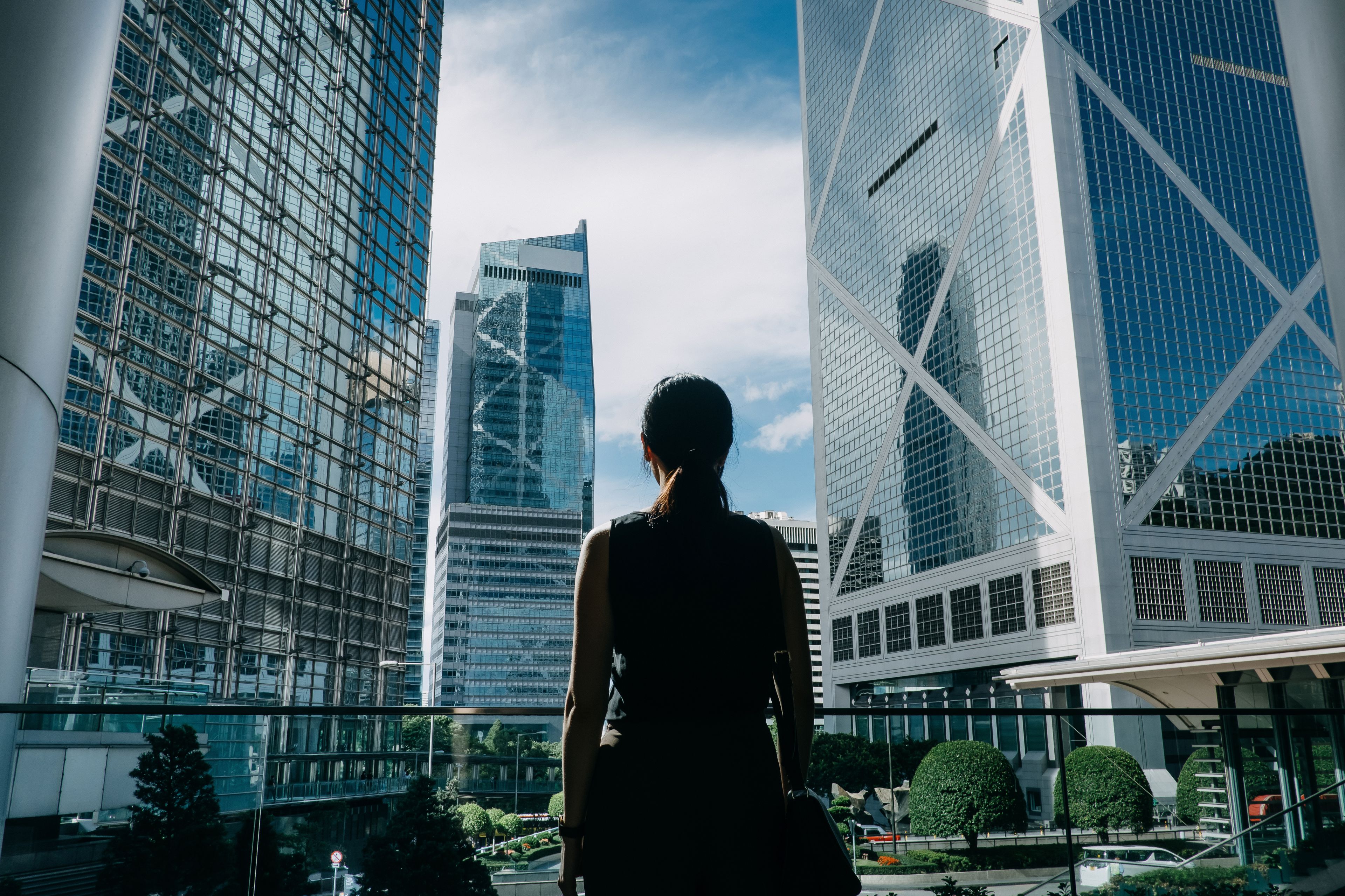 Businesswoman standing in front of skyscrapers