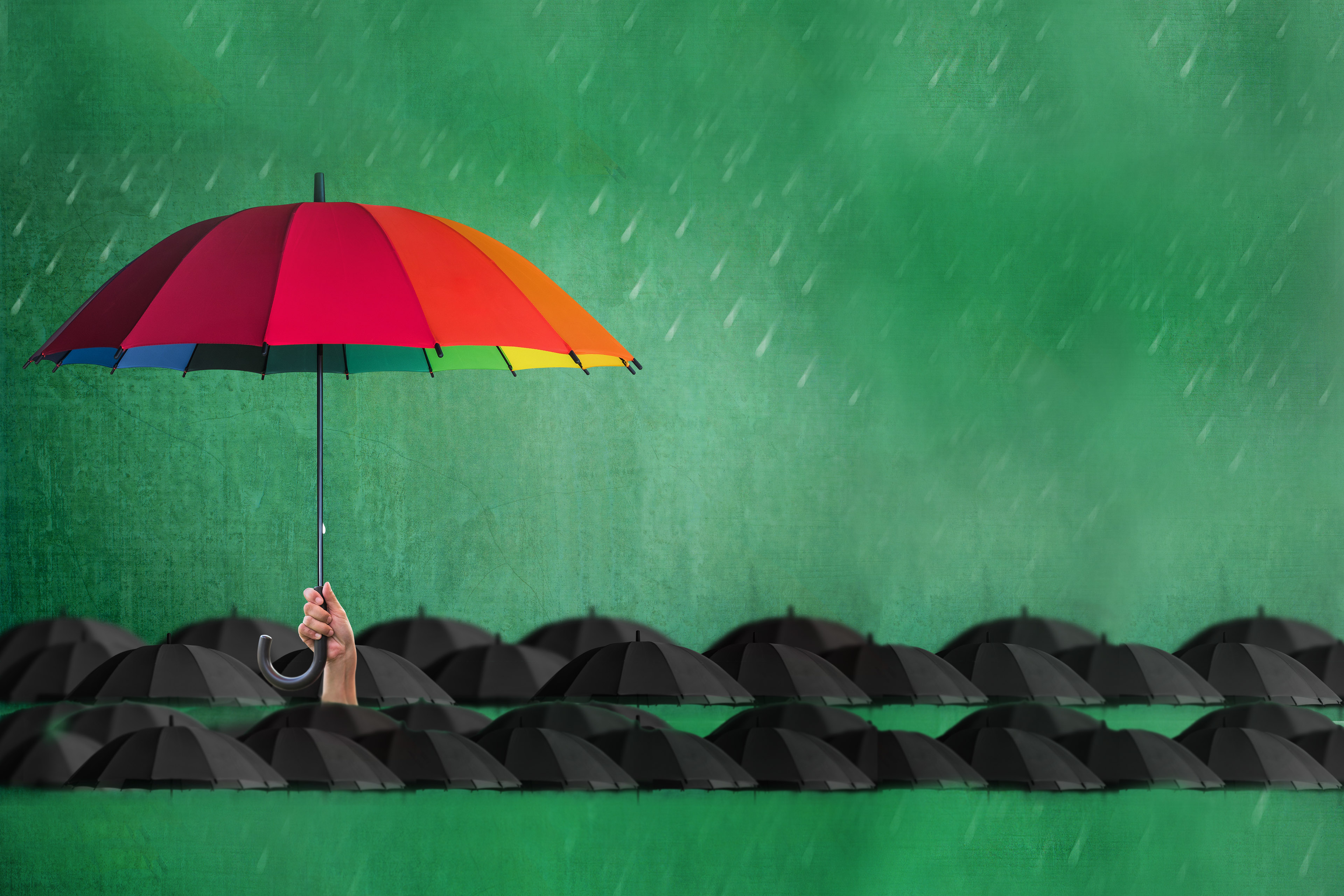 Colourful umbrella held up