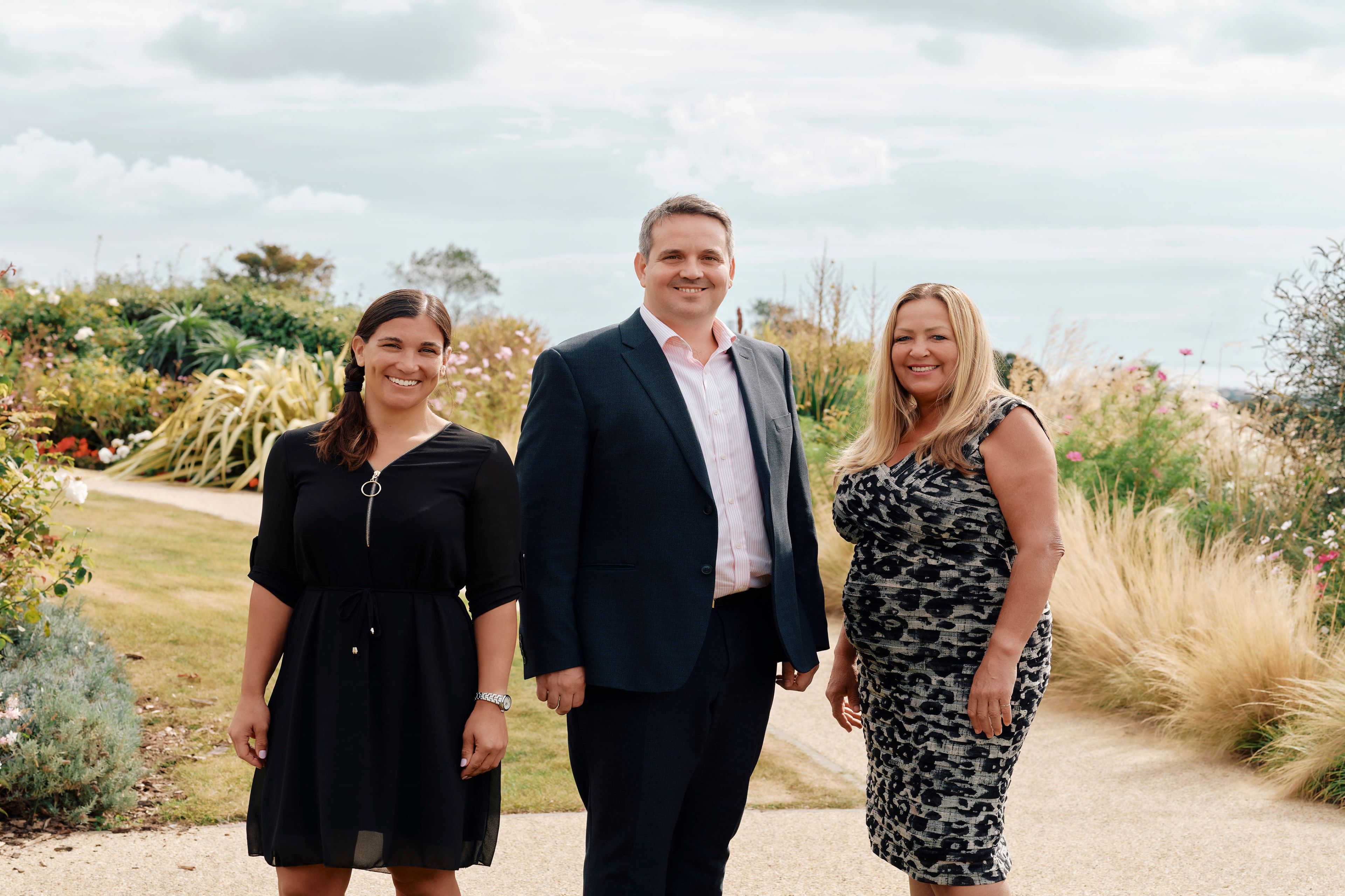 Three people posed for a photograph