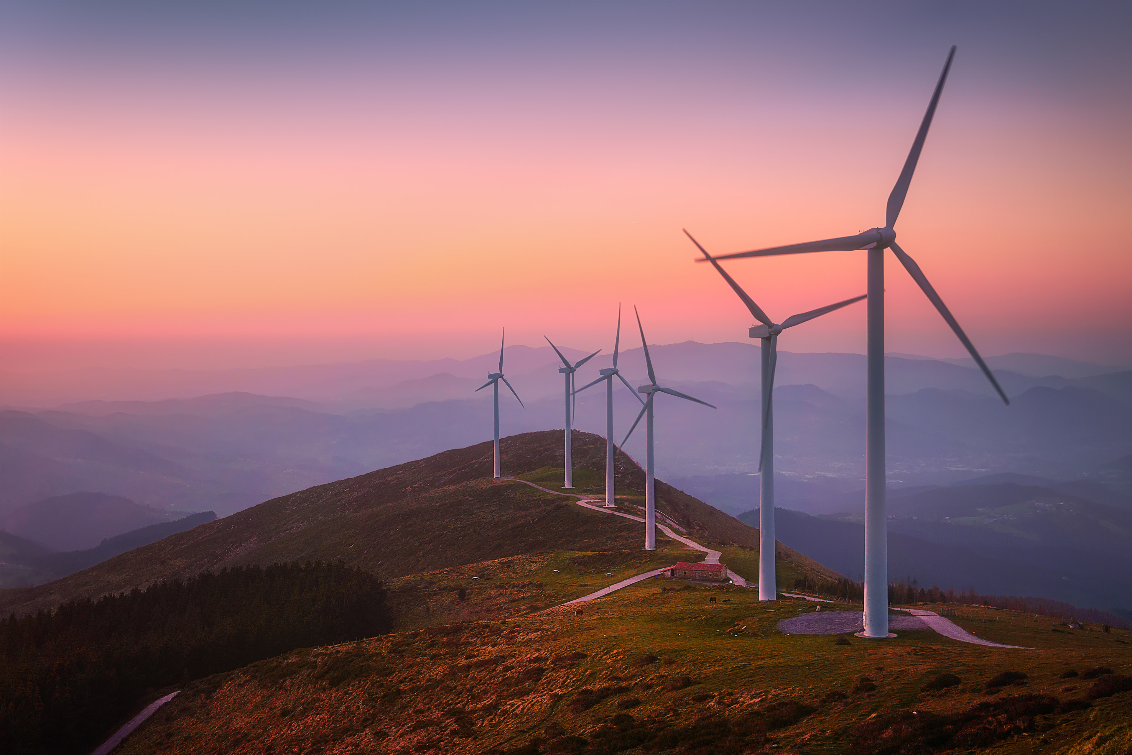 Wind power sustainable resource  in the mountains. Eolic turbines for wind power industry