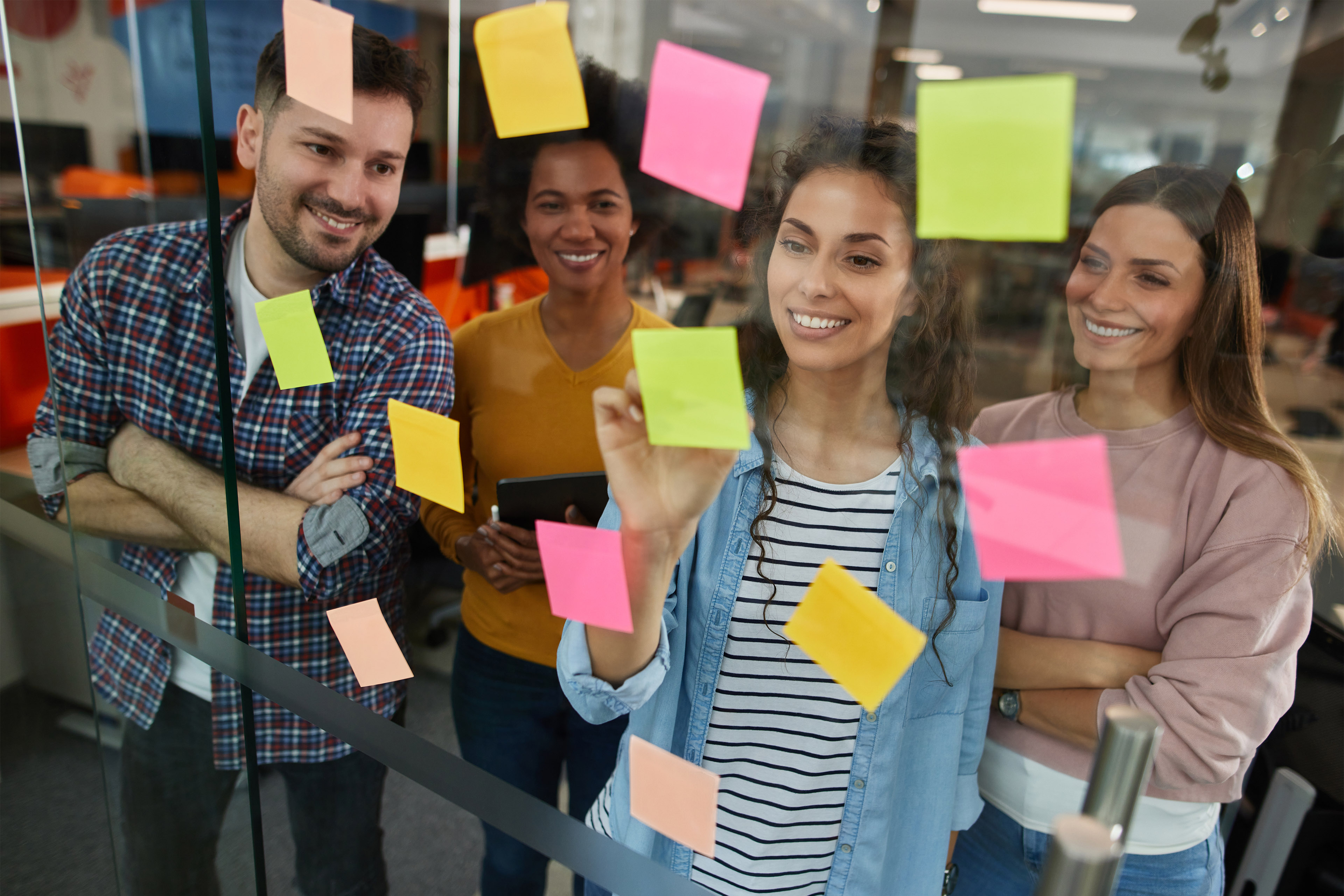 Group of people reading sticky notes