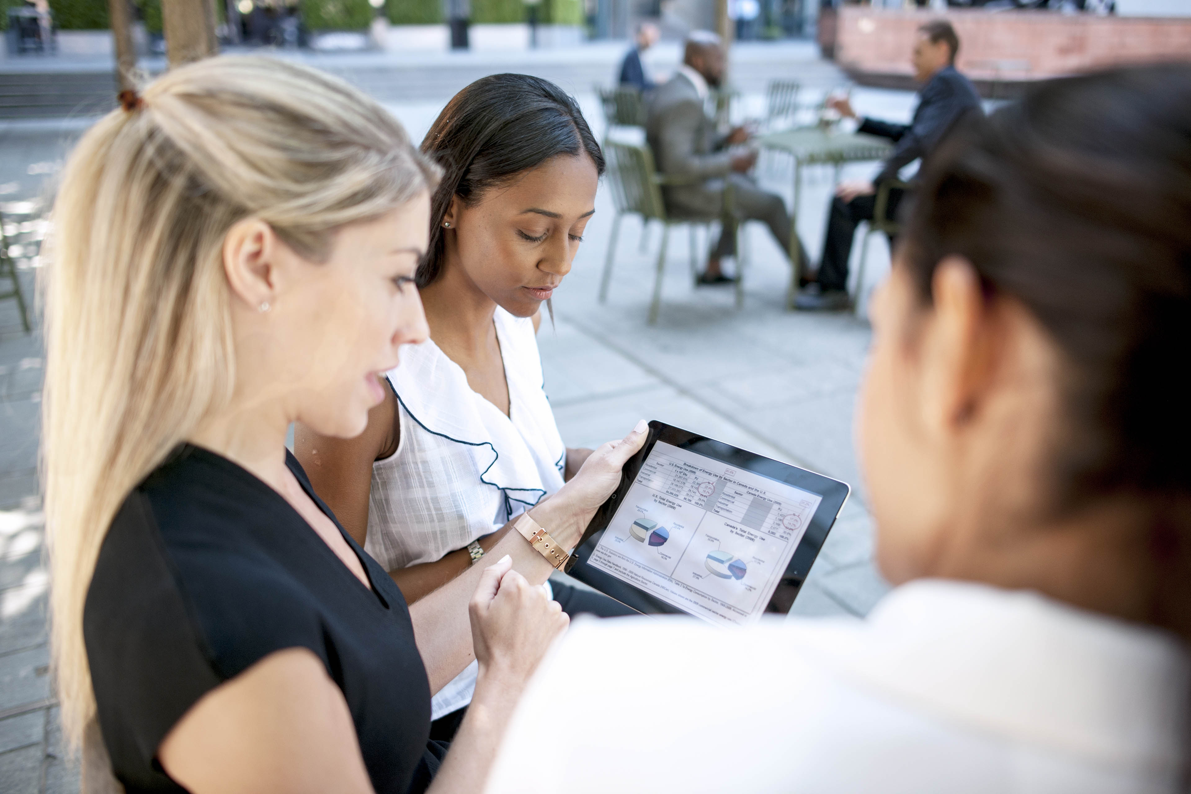 Workers using digital tablet