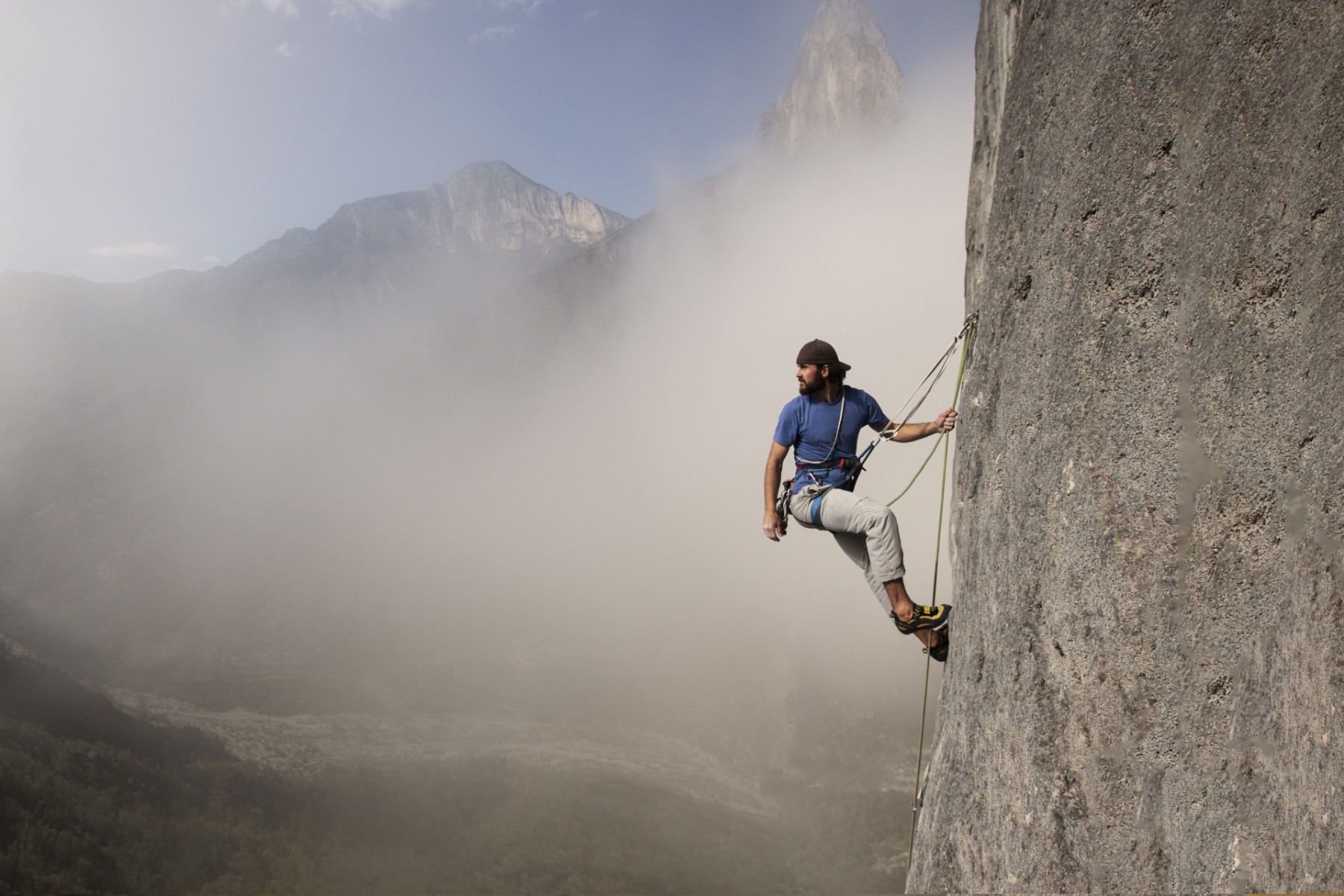 Man hiking the rock wall