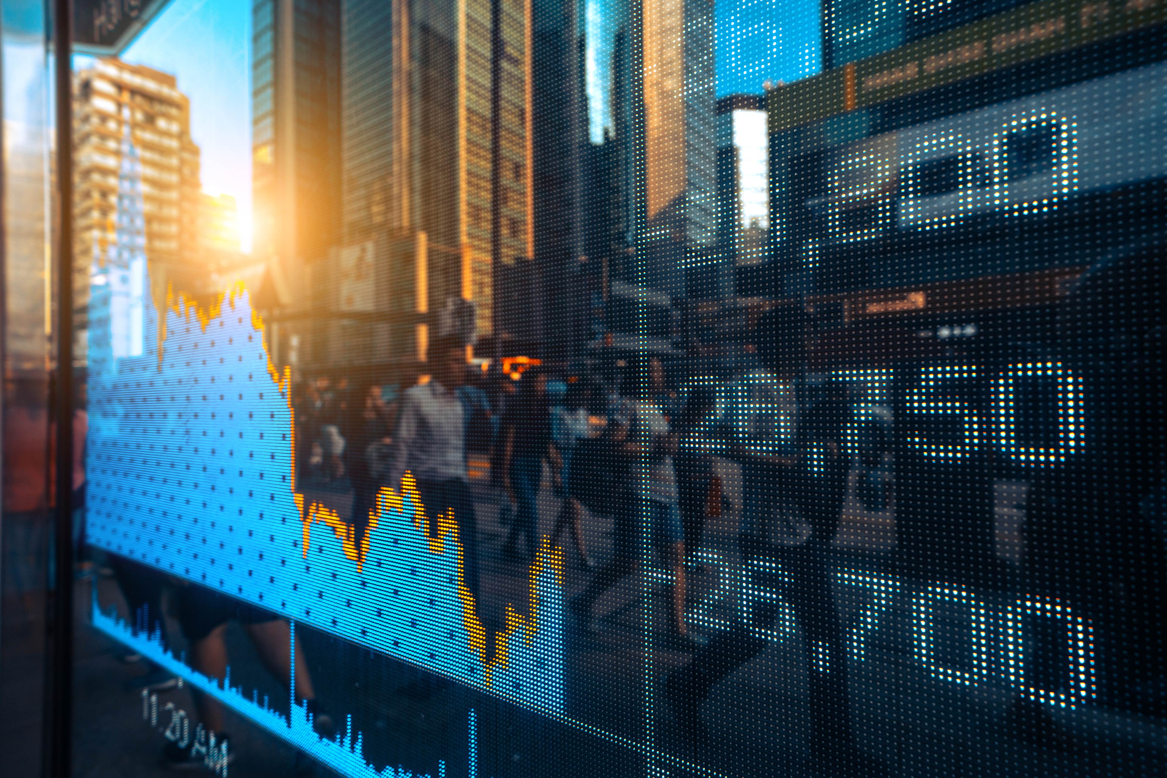 Financial stock market numbers and city light reflections