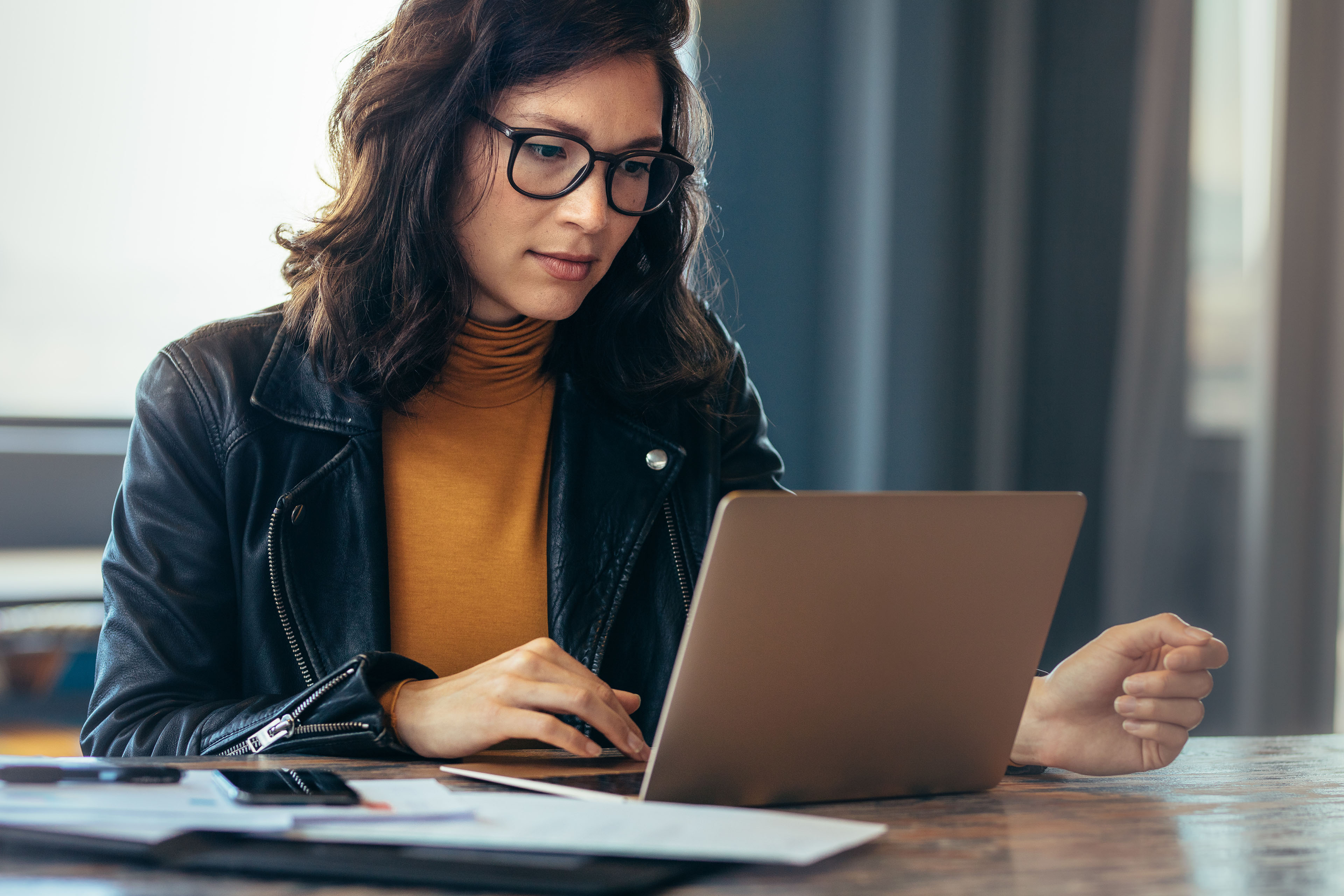 Asian woman working with laptop in office