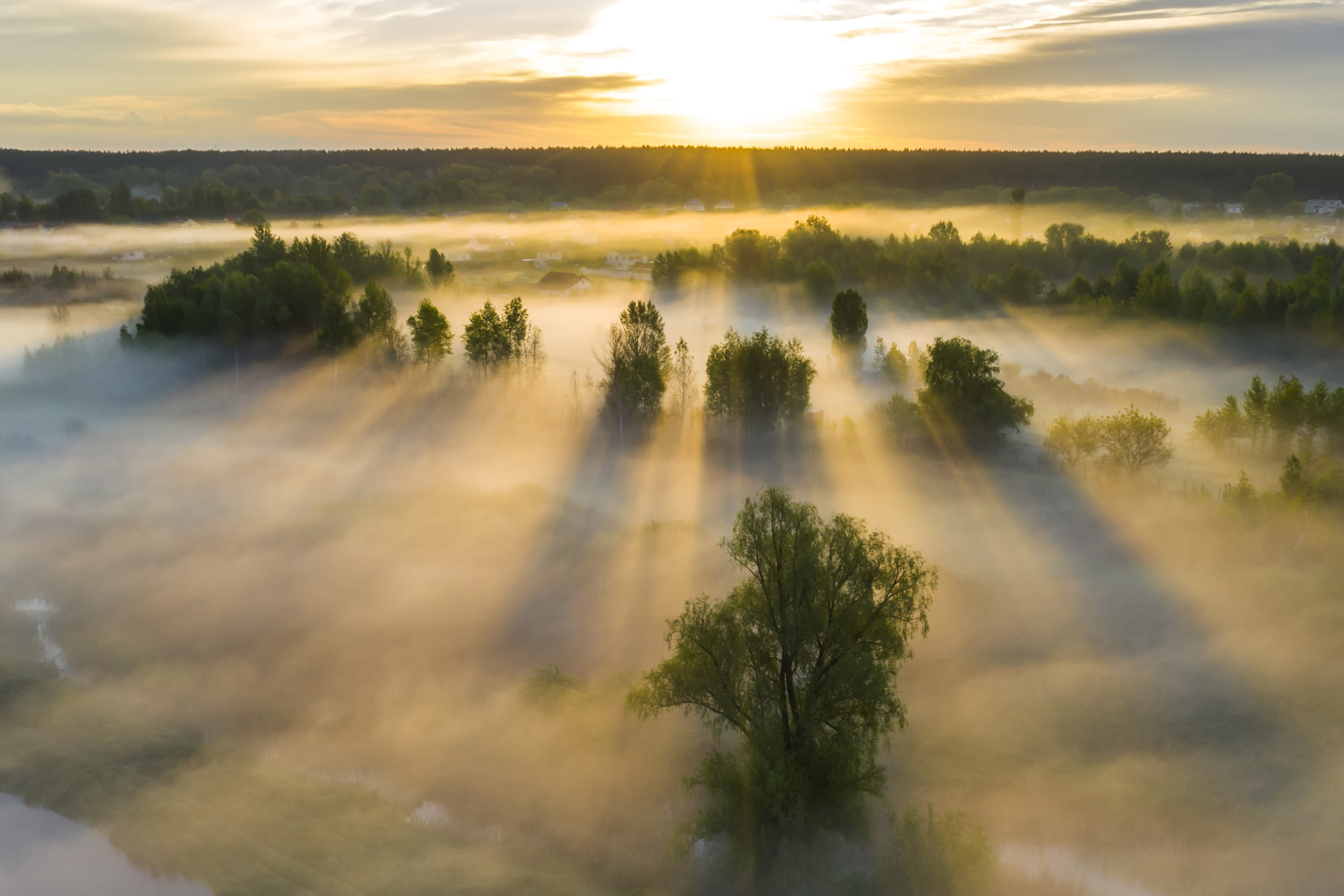 Beautiful misty dawn in the spring on the river. Aerial view