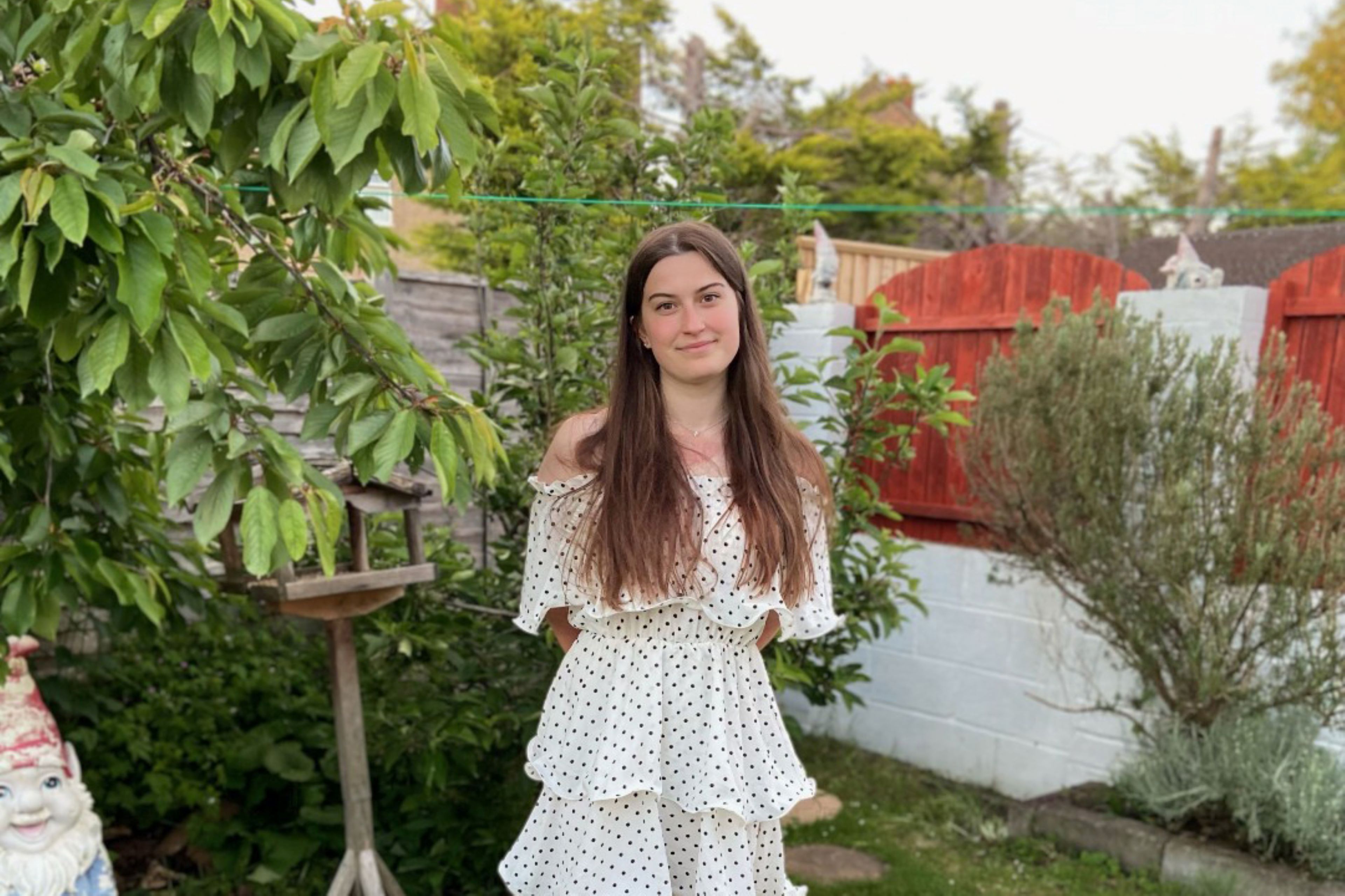 A photo of women outside in a garden