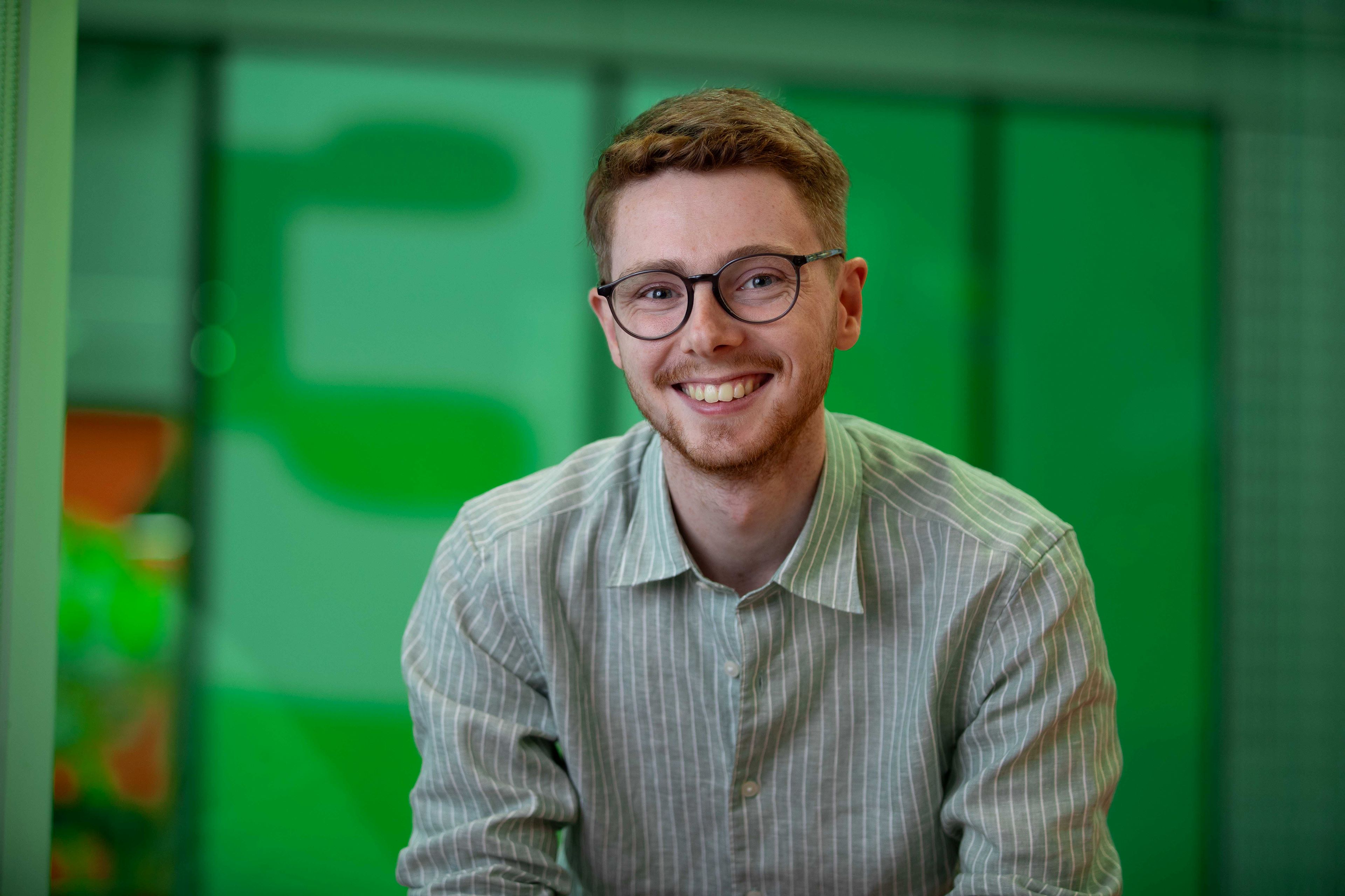 student sitting and smiling