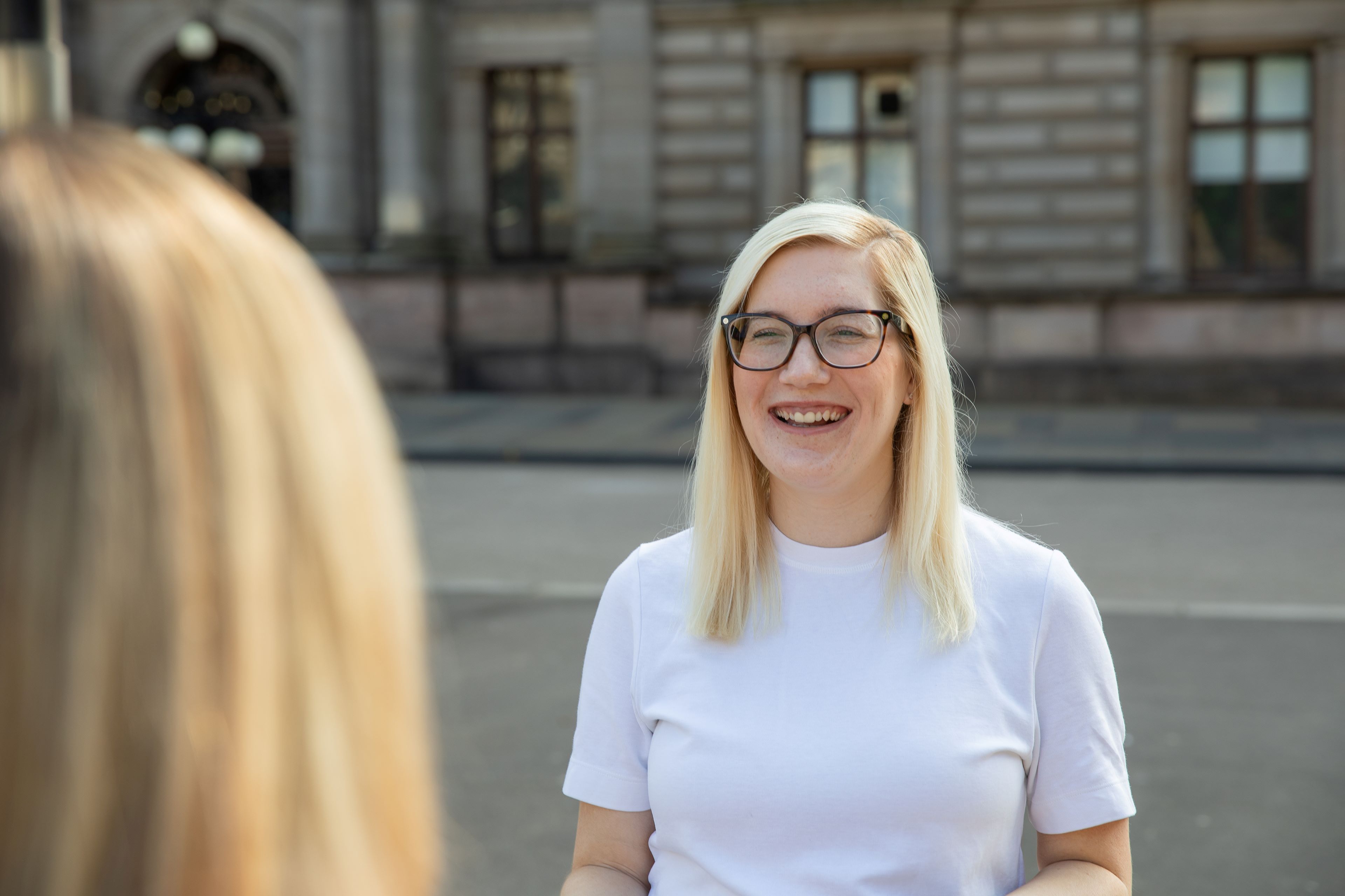 student talking and smiling