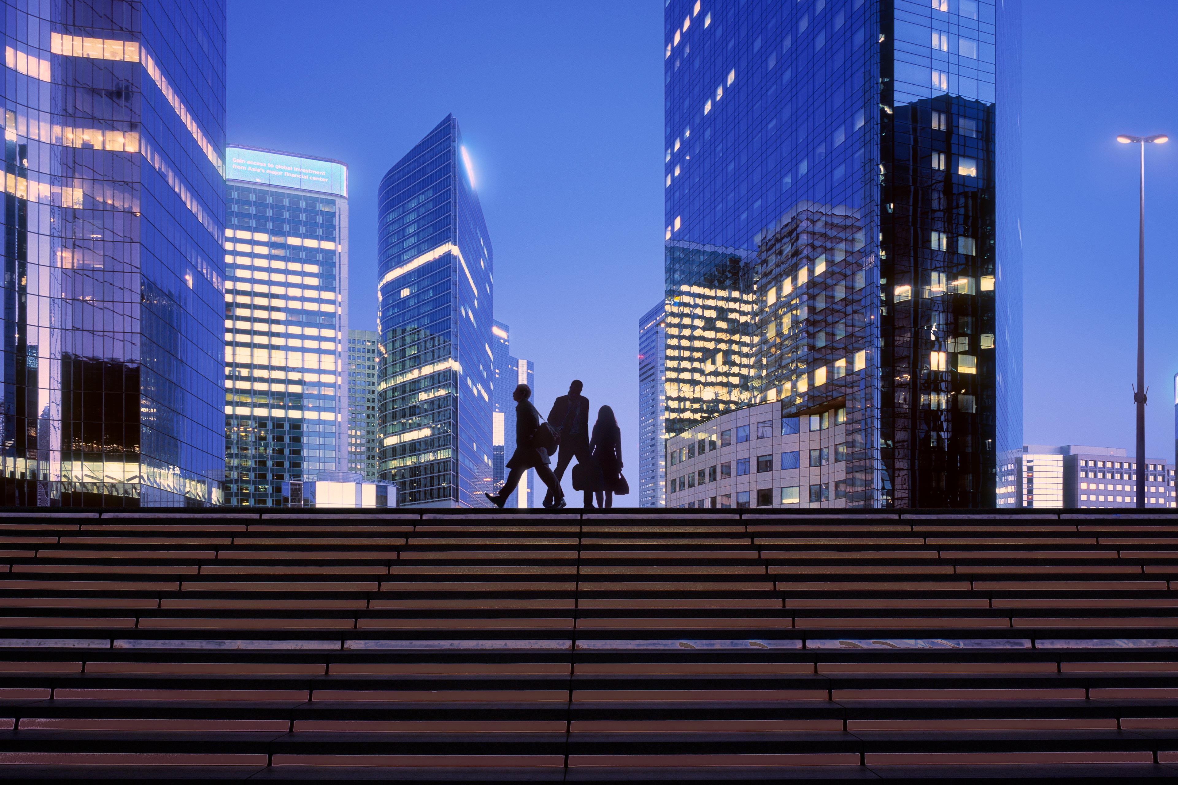 People silhouettes high rise buildings