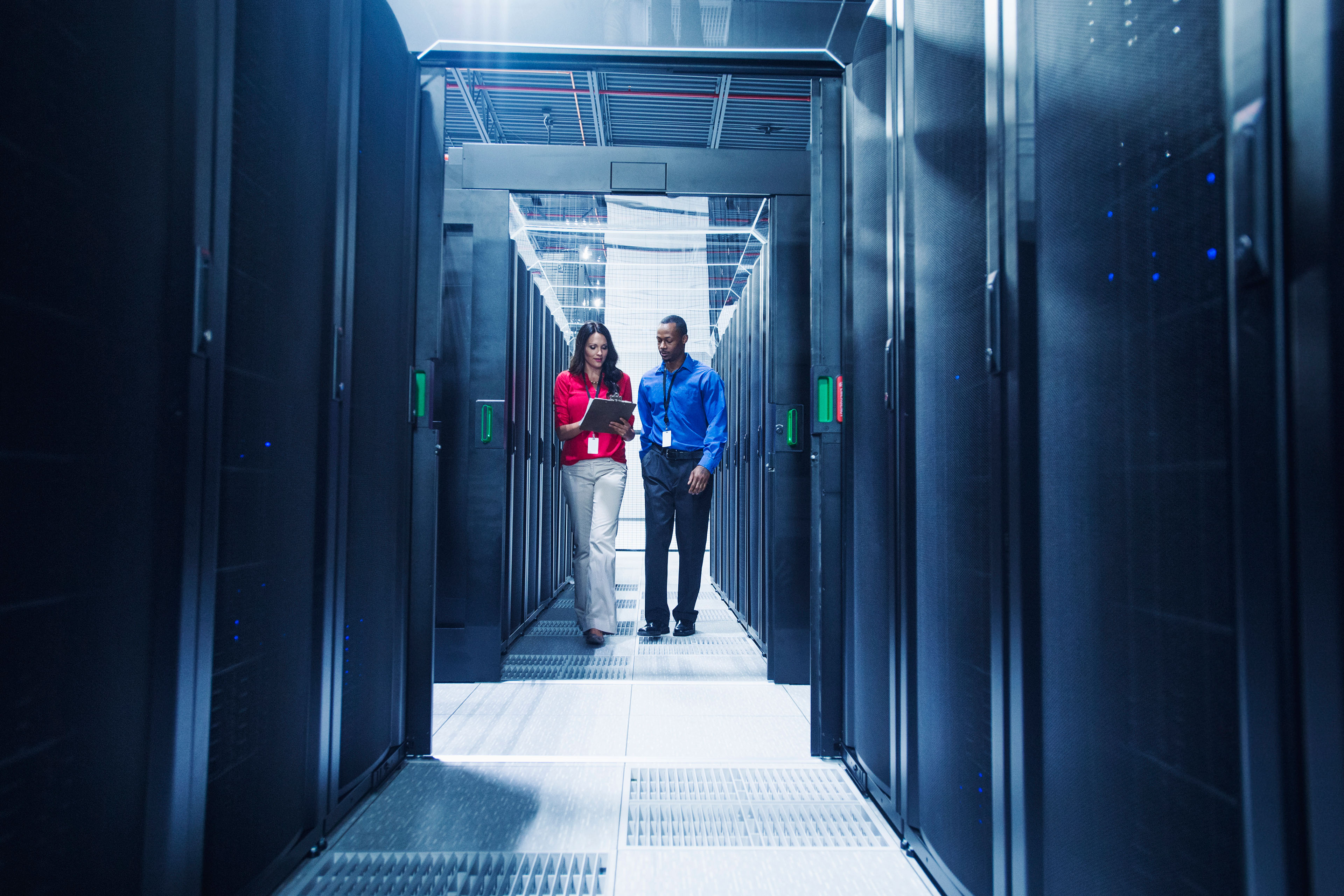 EY Colleagues working together in server room