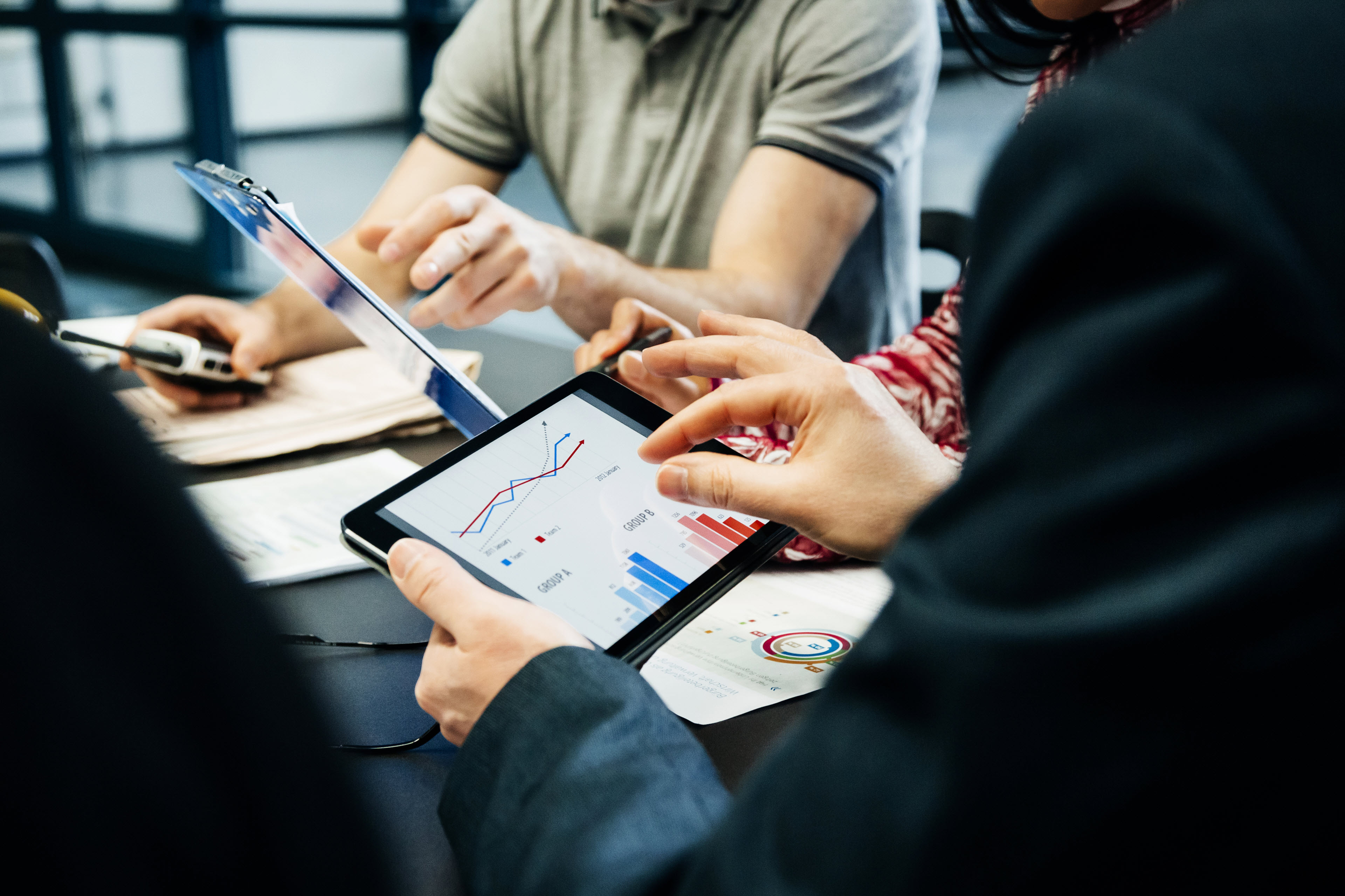 EY employee with tablet data analysis