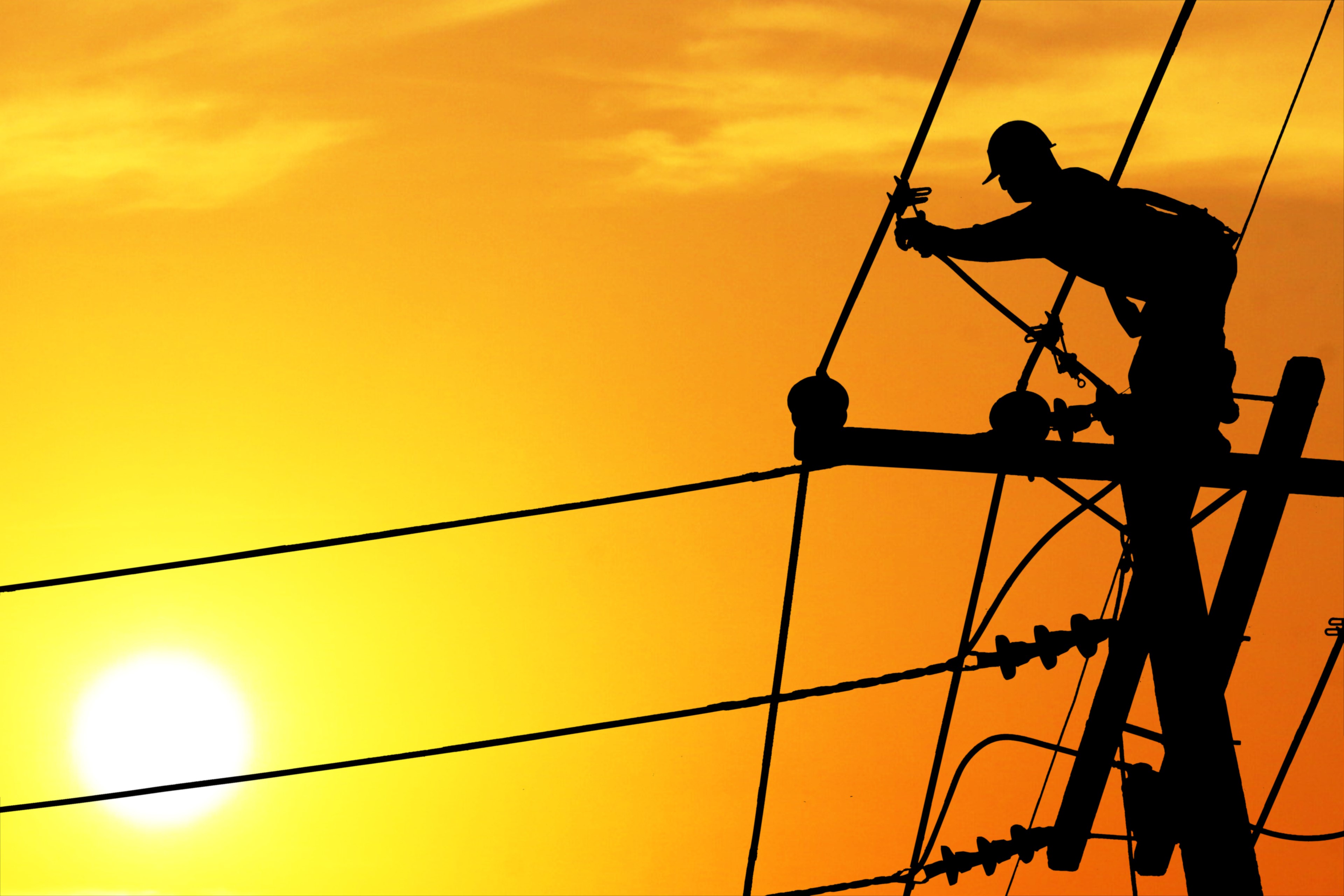 Electricity work at sunset