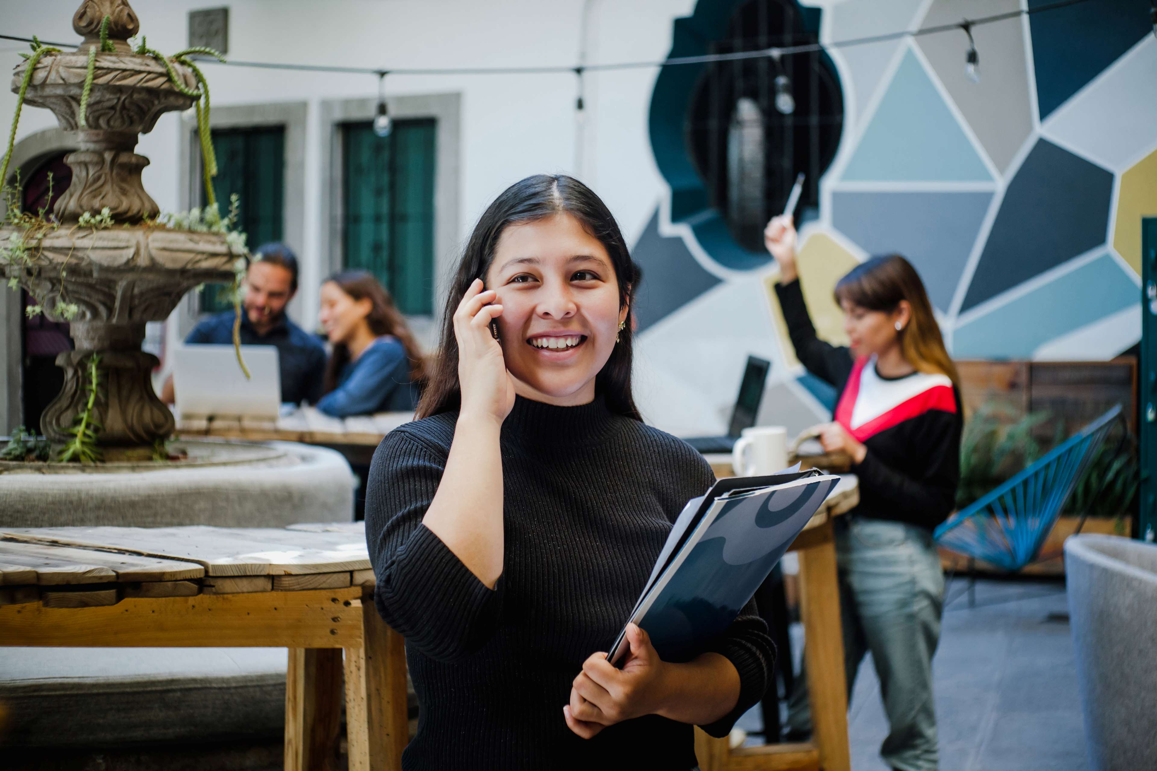 Woman intern talking on phone