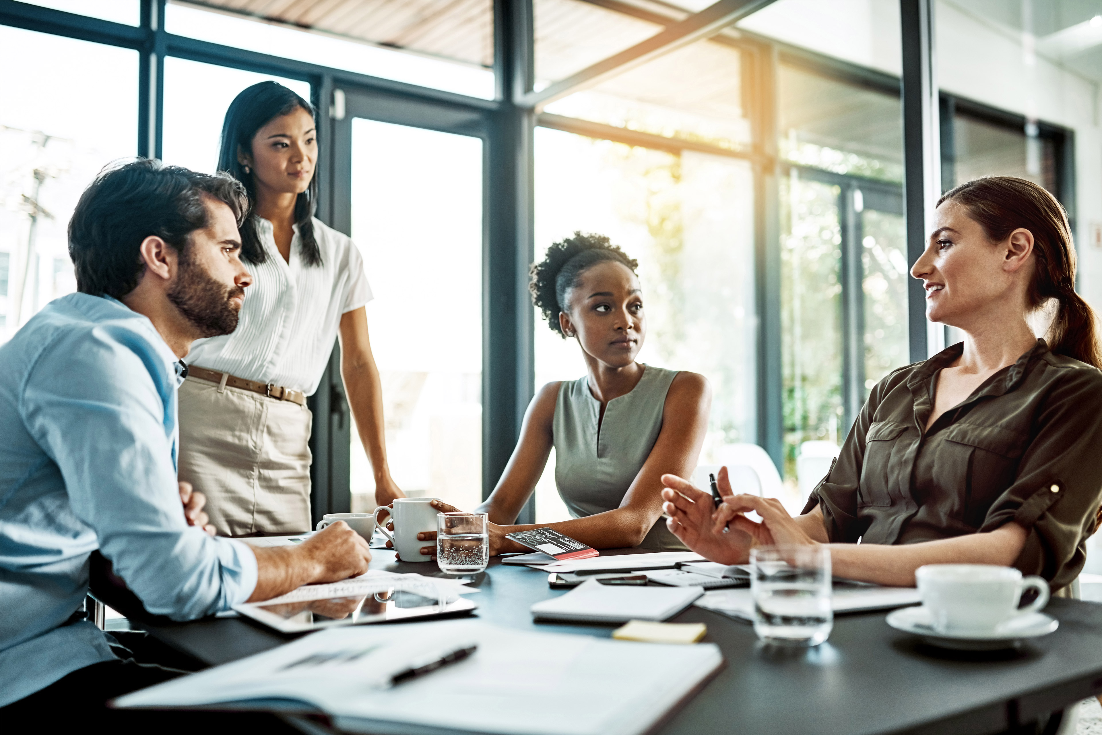 Shot of a group of colleagues having a meeting in a modern office