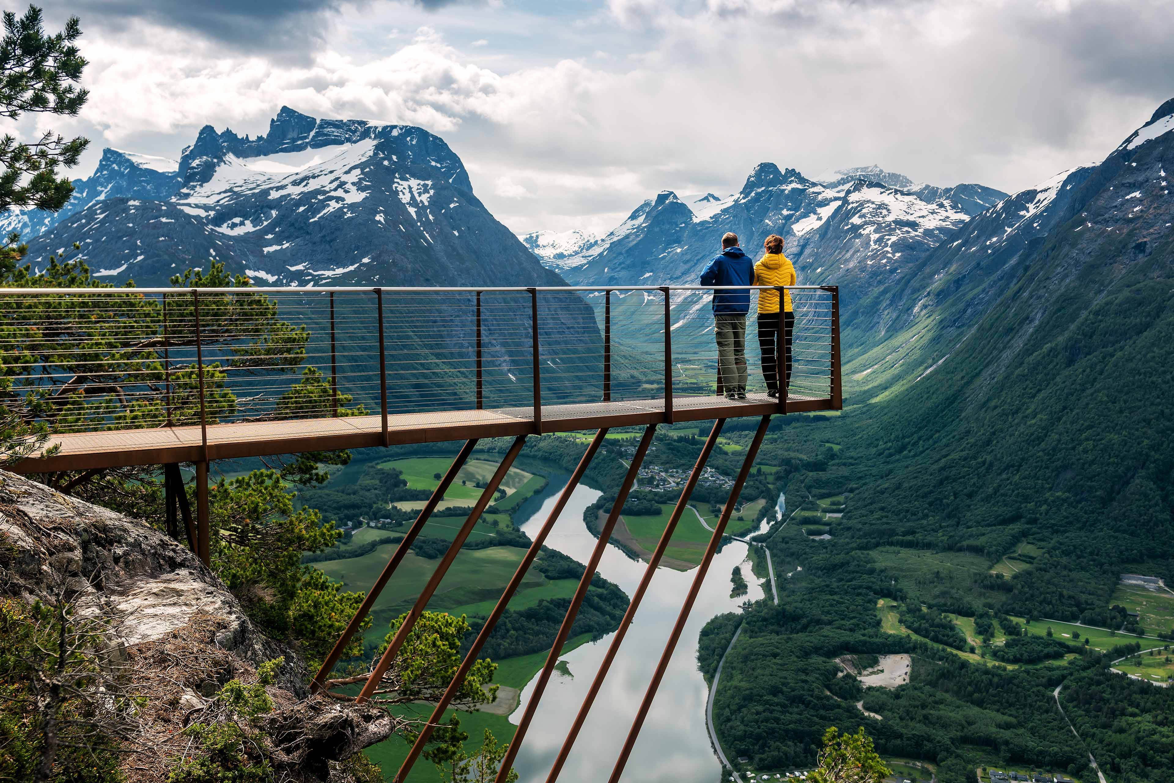 Two people are looking down from the observation deck