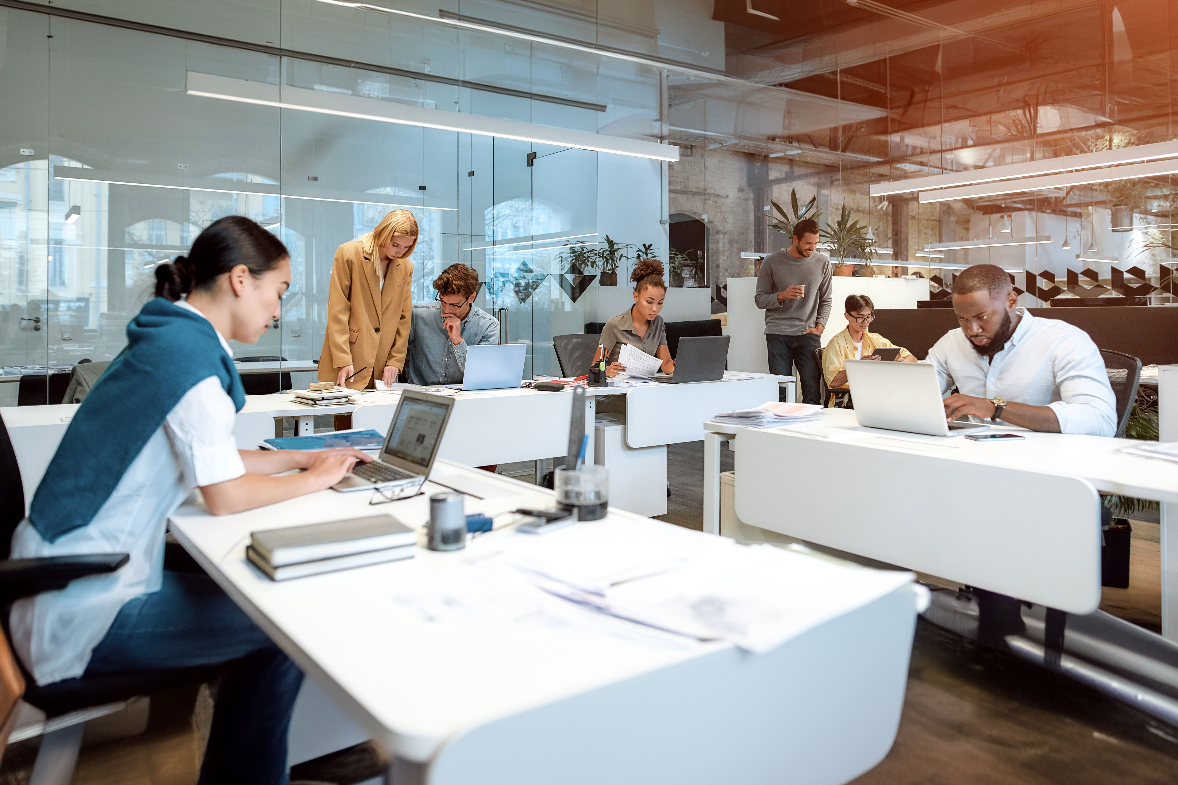 Group of multiracial business people working together in the creative co-working space.