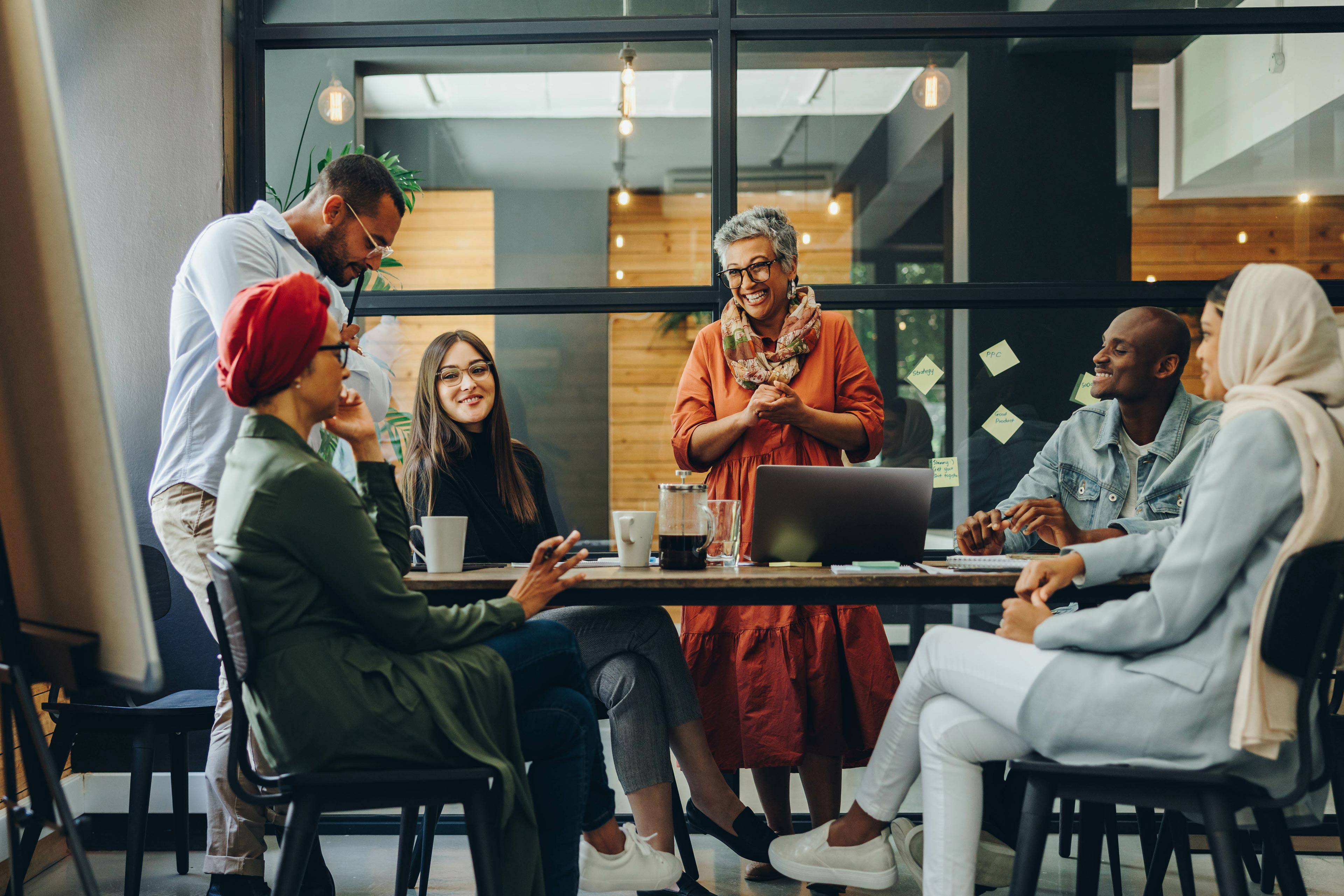 Happy businesspeople having a meeting in a boardroom